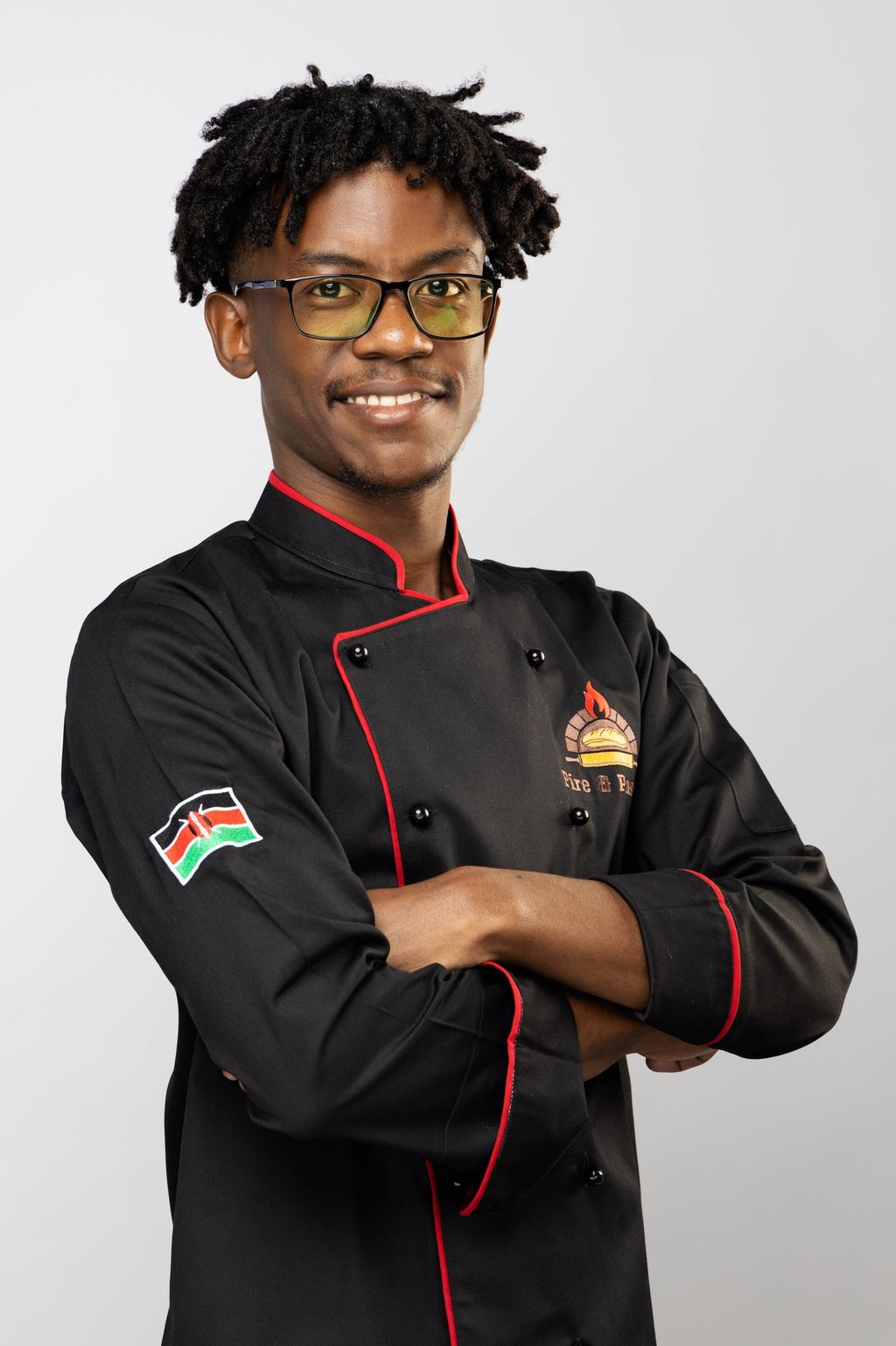 a man in a chef's uniform with a chef's coat