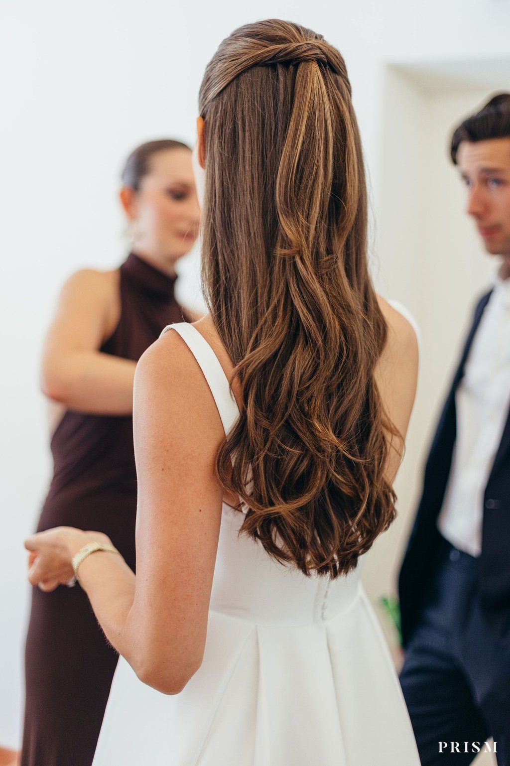 Beautiful long hair styled into half up half down hairstyle