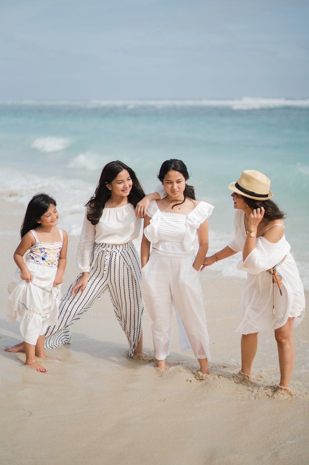 Children walking together on the beach at Karma Kandara Bali  