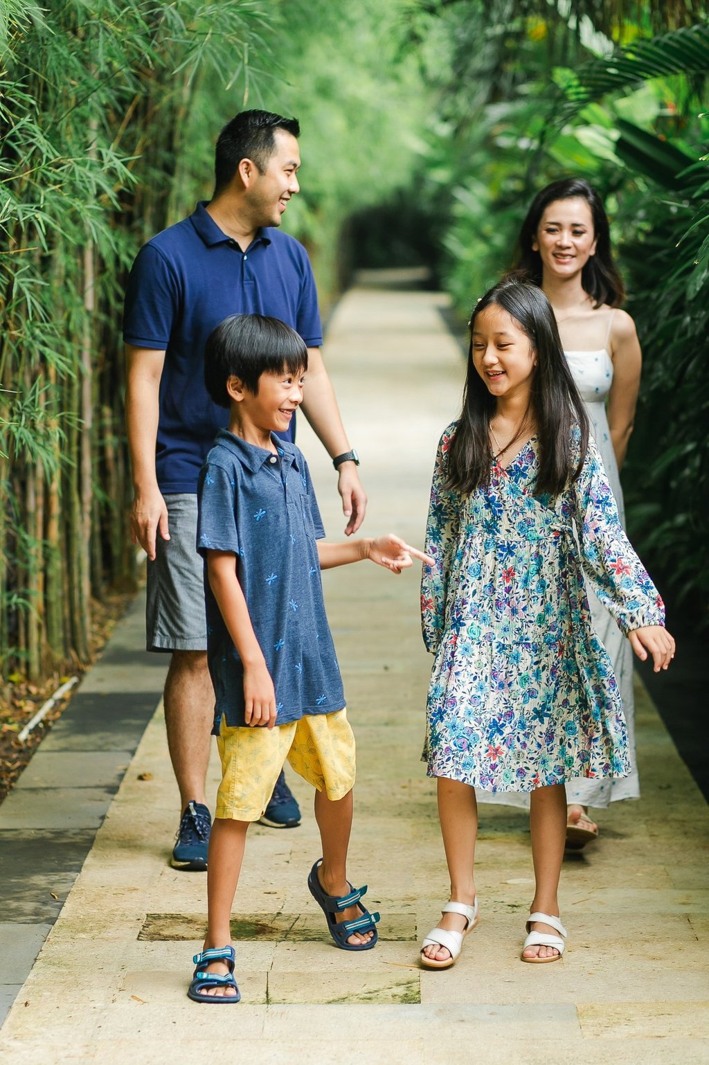 candid family walking moment captured at Westin Nusa Dua Bali during relaxed session