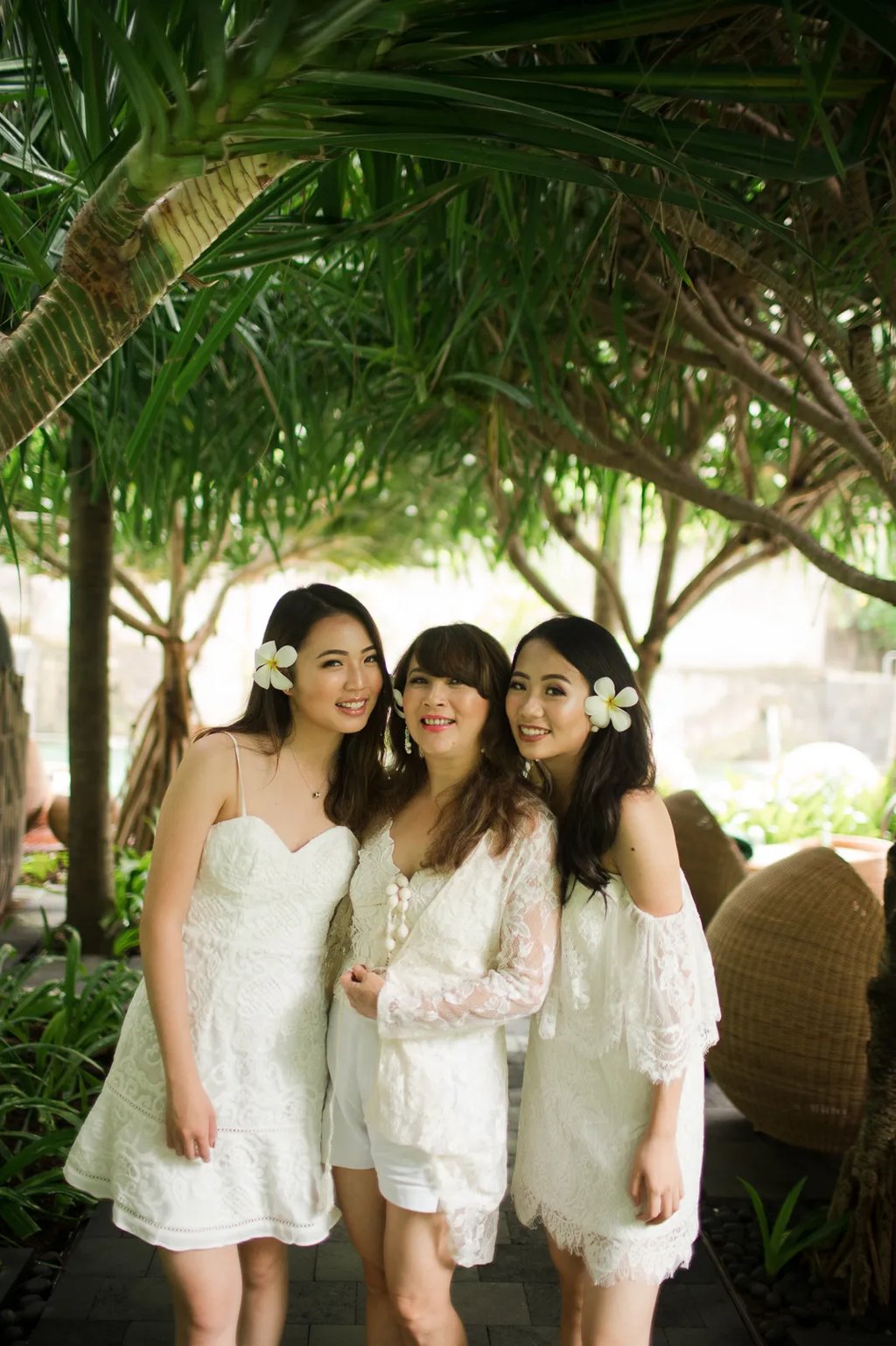 Janice family enjoying a tropical garden moment during a family photography session at Indigo Seminyak Bali