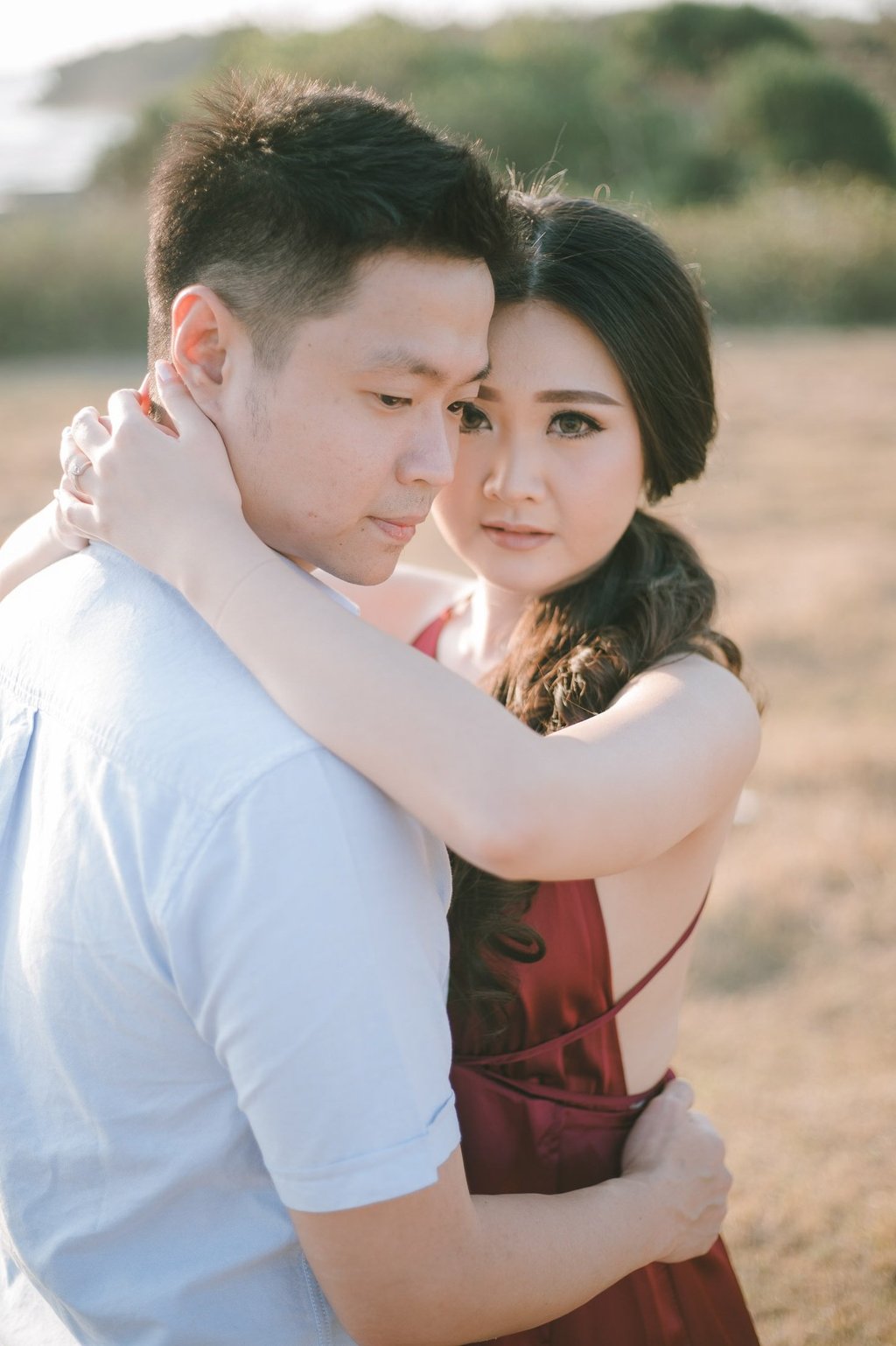 Romantic golden hour couple portrait at Pantai Nyanyi Bali.