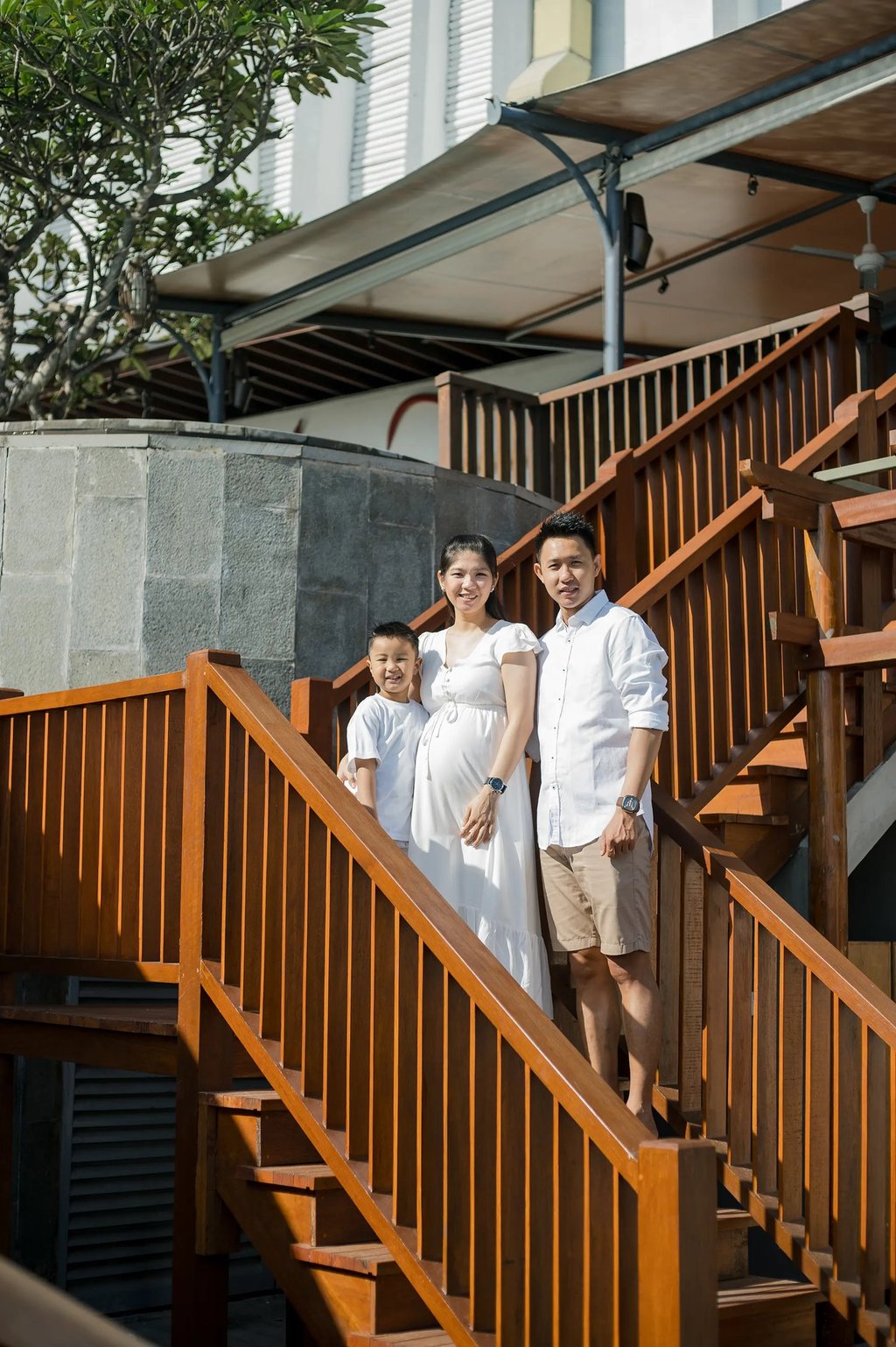 Family walking down the staircase during a relaxed family photography session at Anantara Uluwatu Bali.