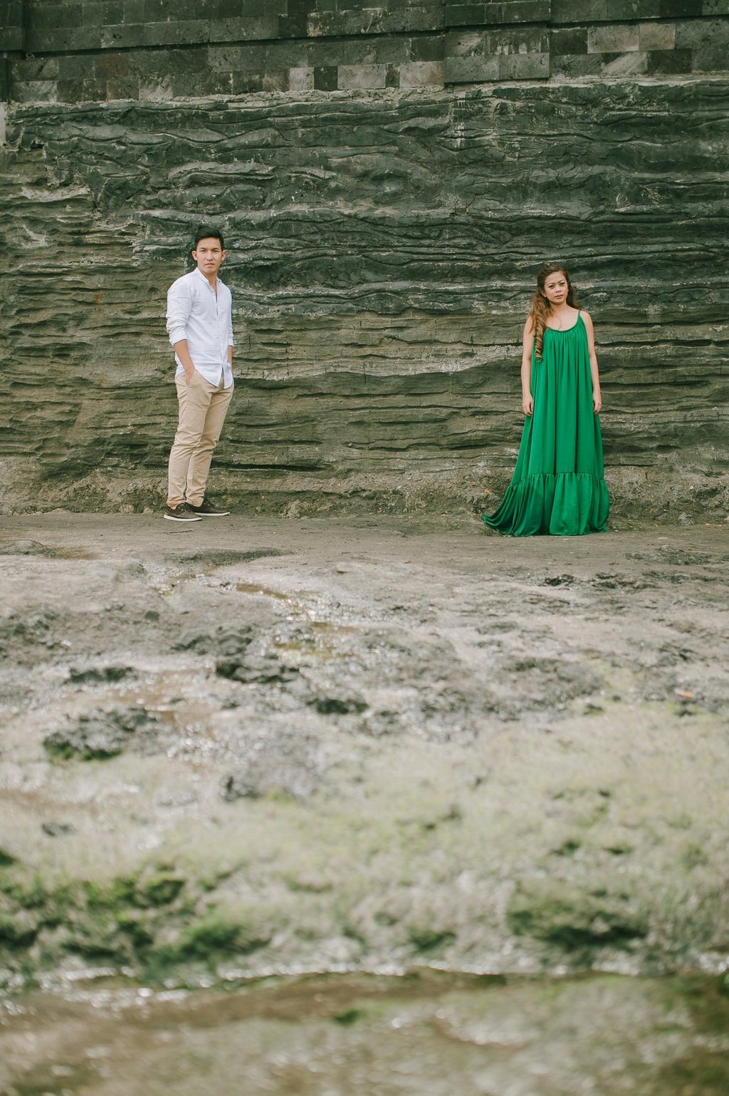 Intimate couple portrait with Tanah Lot temple in the background during a Bali photography session.