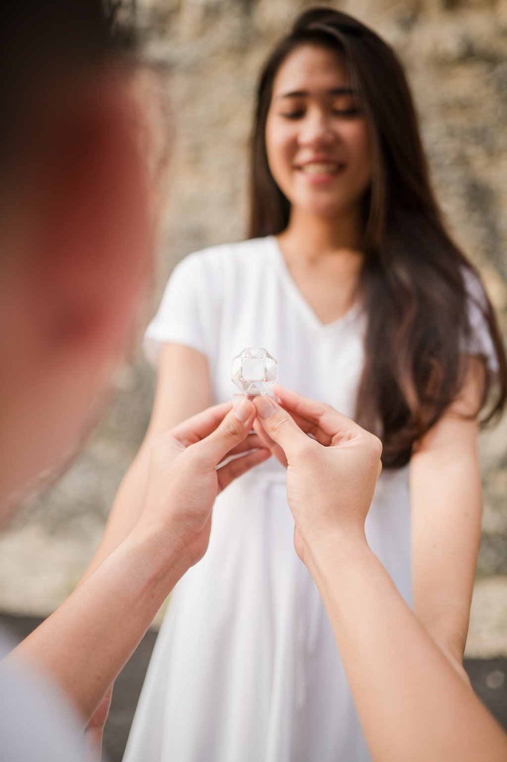 Close up engagement ring moment during proposal at Melasti Beach Bali