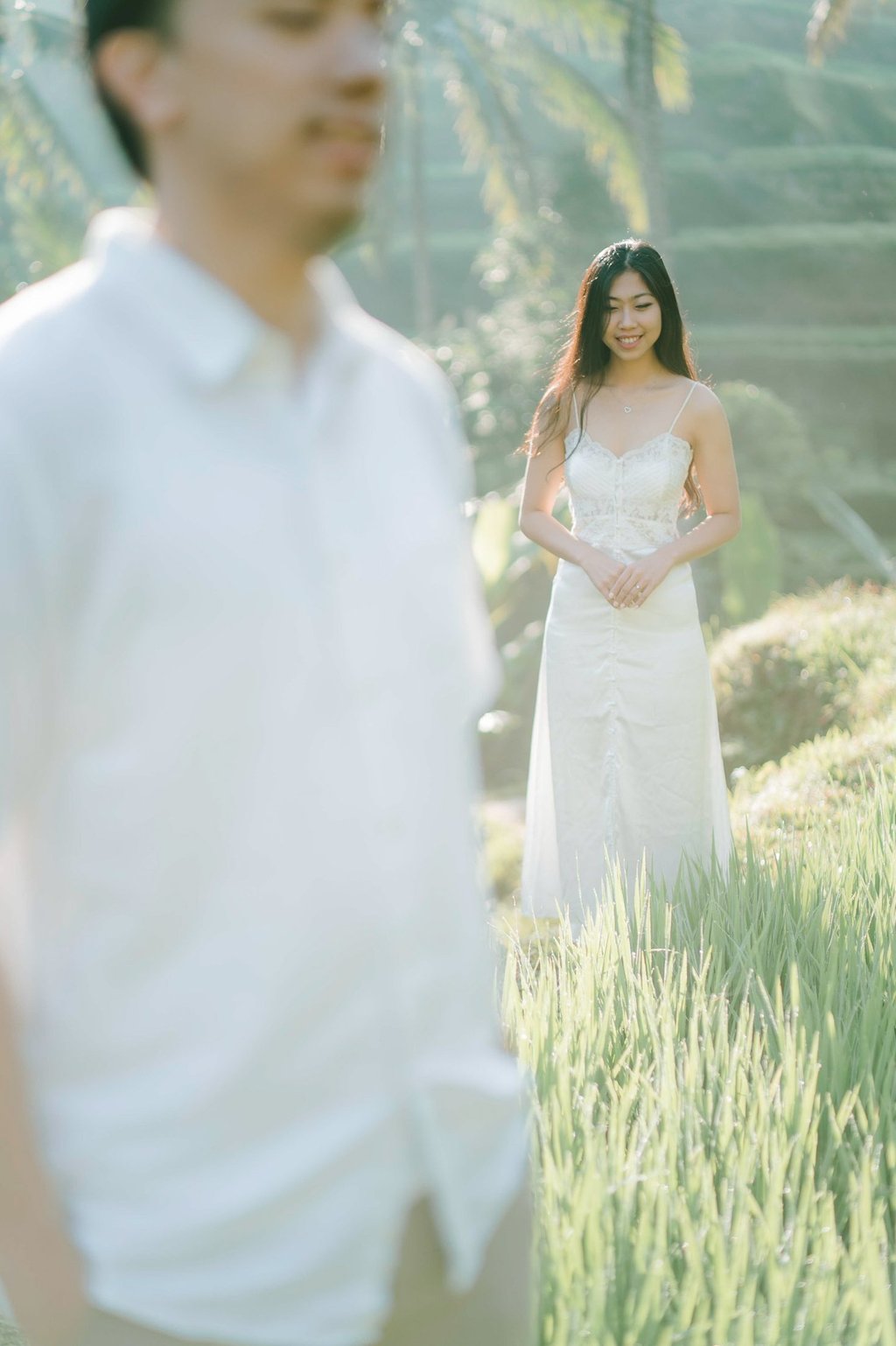Woman standing in the rice terrace during an intimate couple photography session at Tegalalang Ubud Bali.