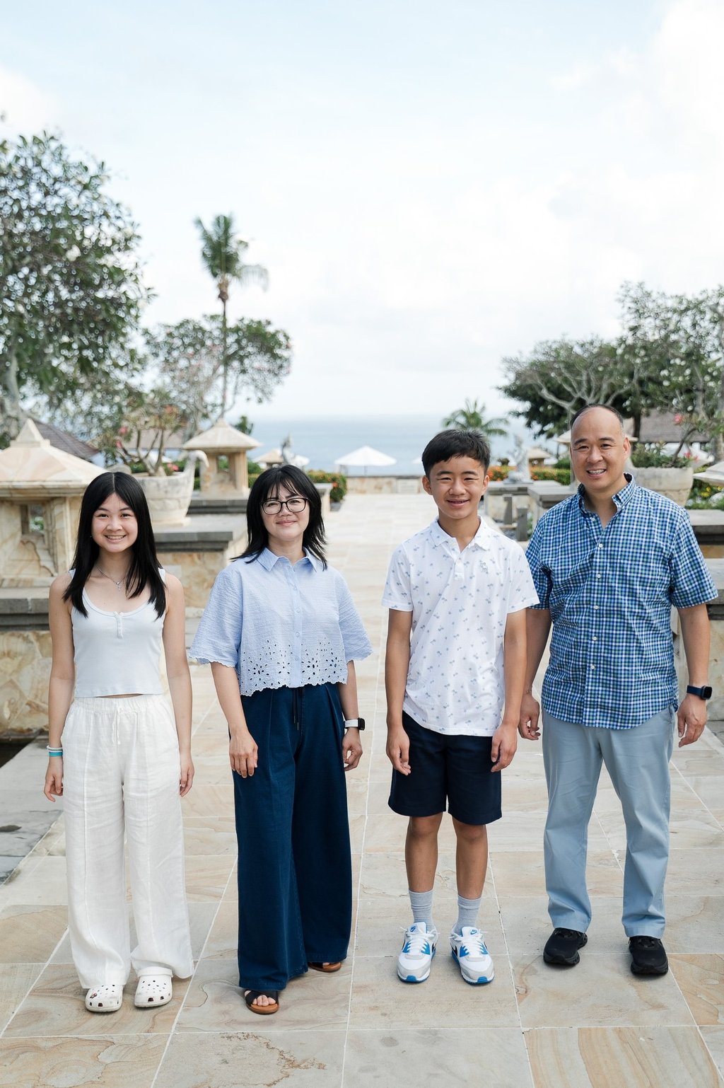 Simple and clean family portrait with natural light during a relaxed session at Ayana Resort Jimbaran Bali