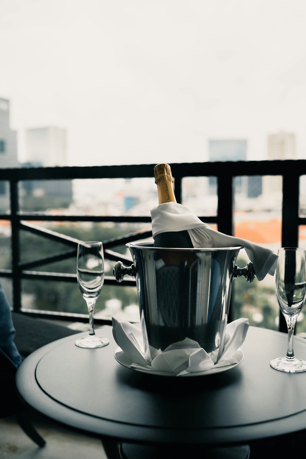 Chilled champagne bucket with two glasses; Photo by Albert Vincent Wu on Unsplash