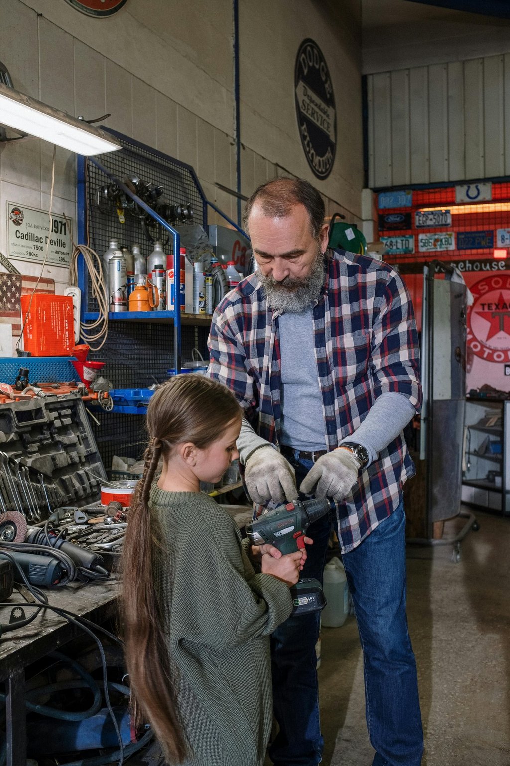 Dad and child learning home repair skills at Men’s Foundry father-child night