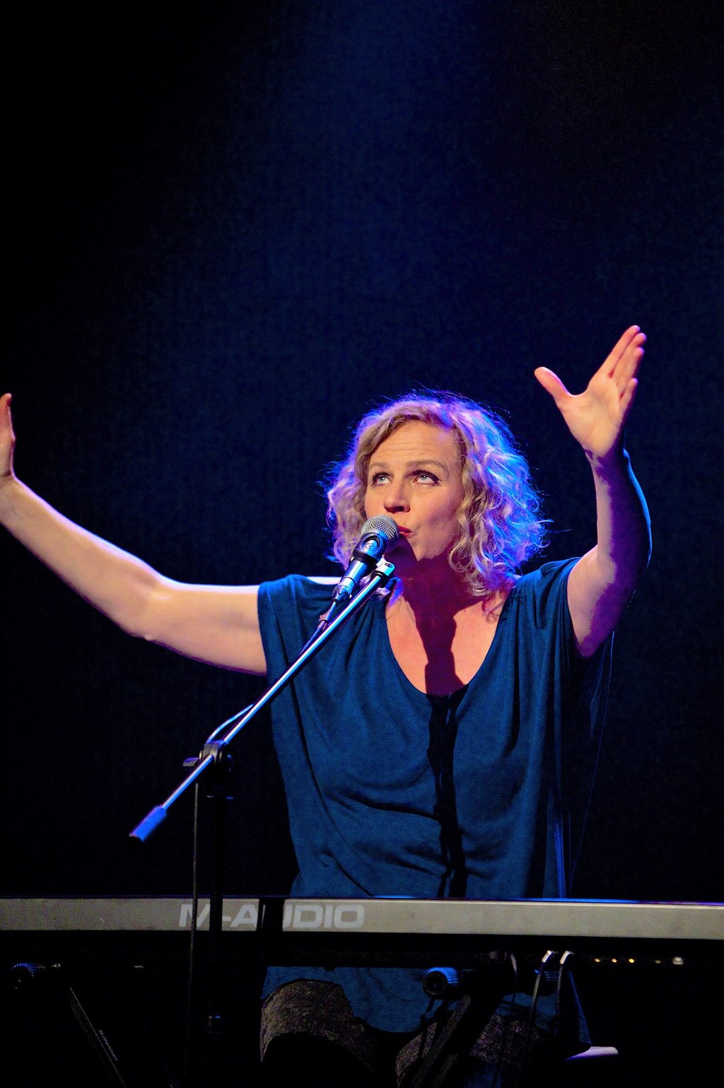 a woman in a black and white photo of a microphone and a microphone