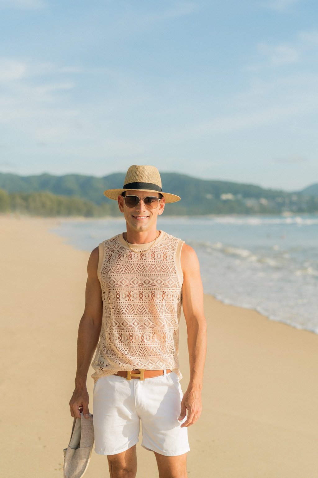Rick Silvia wearing a sun hat on a beach in Thailand