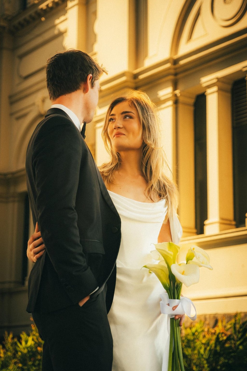 Editorial wedding couple portrait with warm light at Carlton Gardens Melbourne