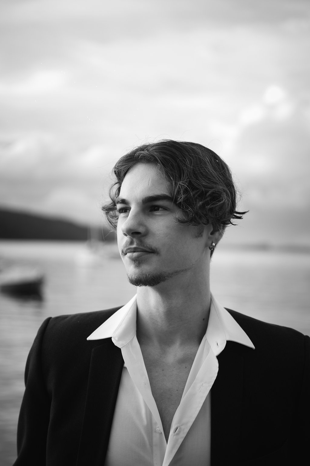 a man in a suit and a white shirt