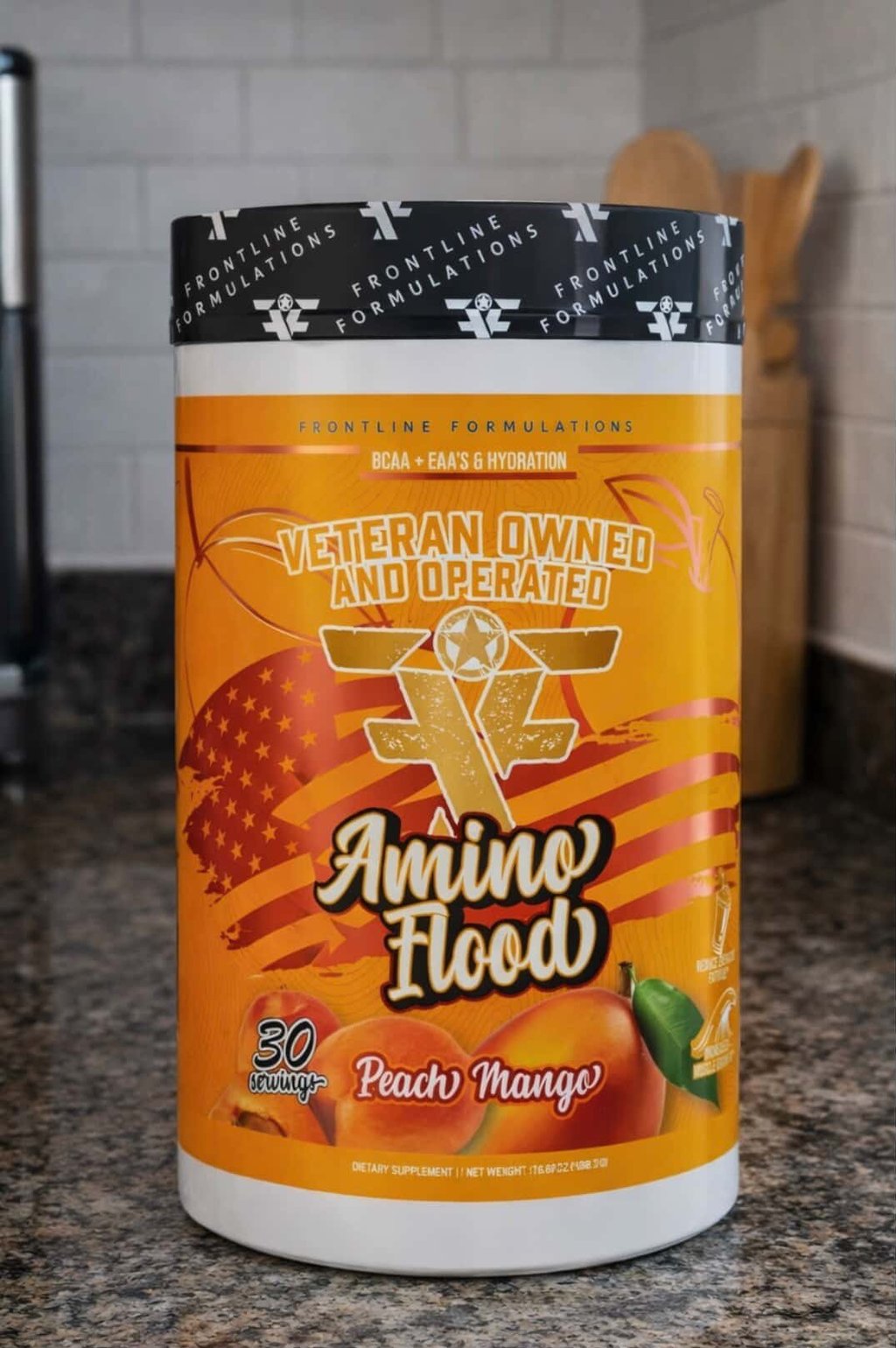 Amino Flood BCAA and EAA Powder in bottle on a counter