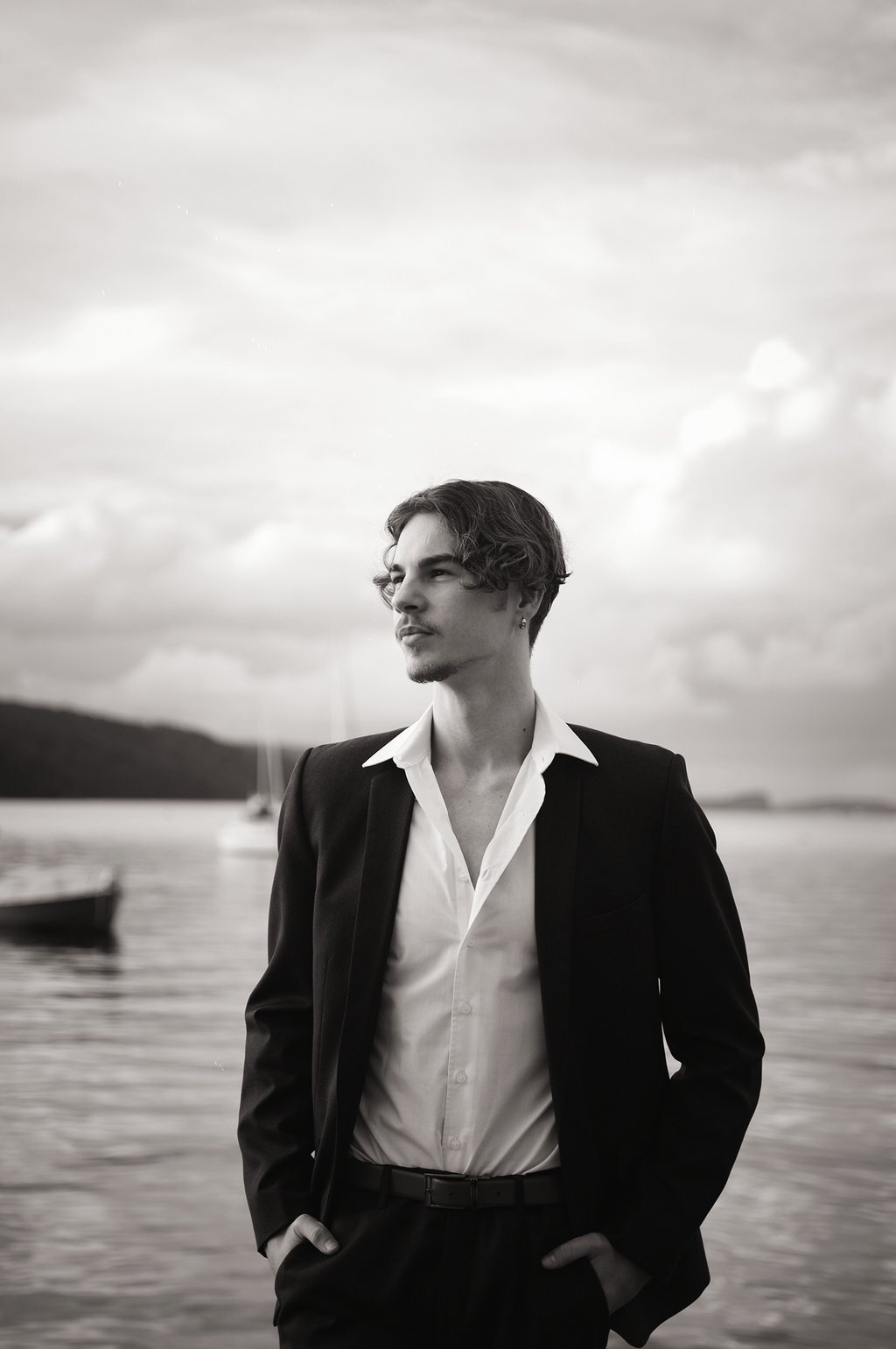 a man in a suit and white shirt