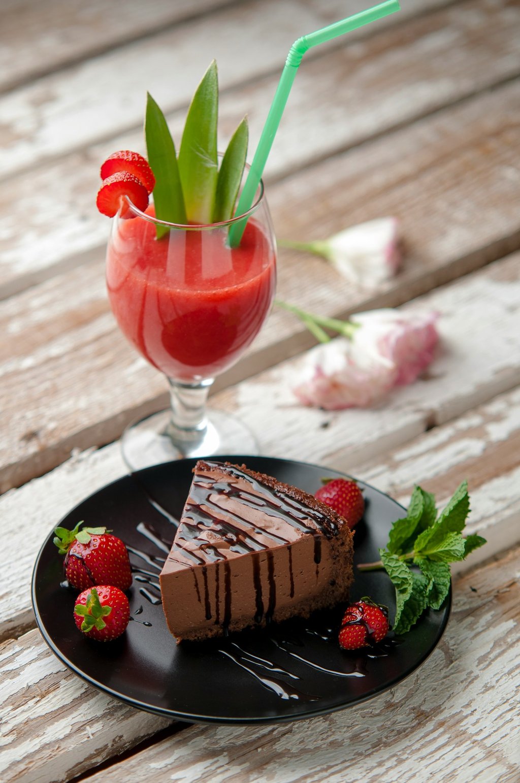 a chocolate cake with strawberries dessert in the restaurant table.Hospitality Startup Guidance