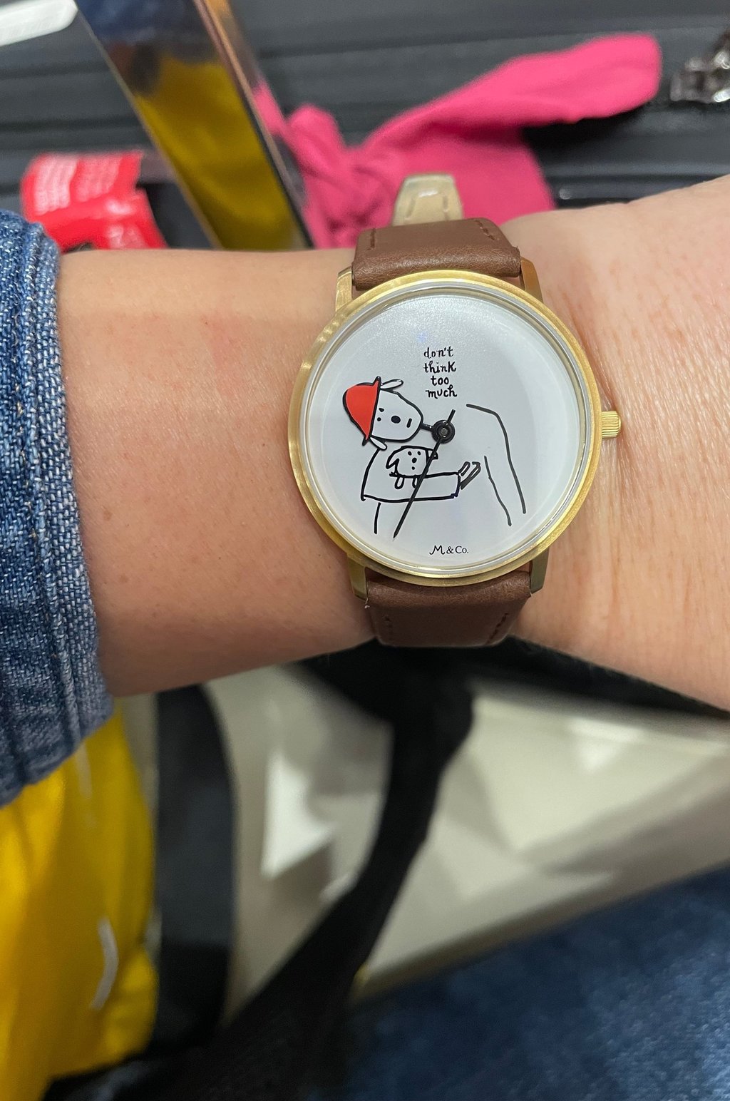 a watch face saying "don't think too much"