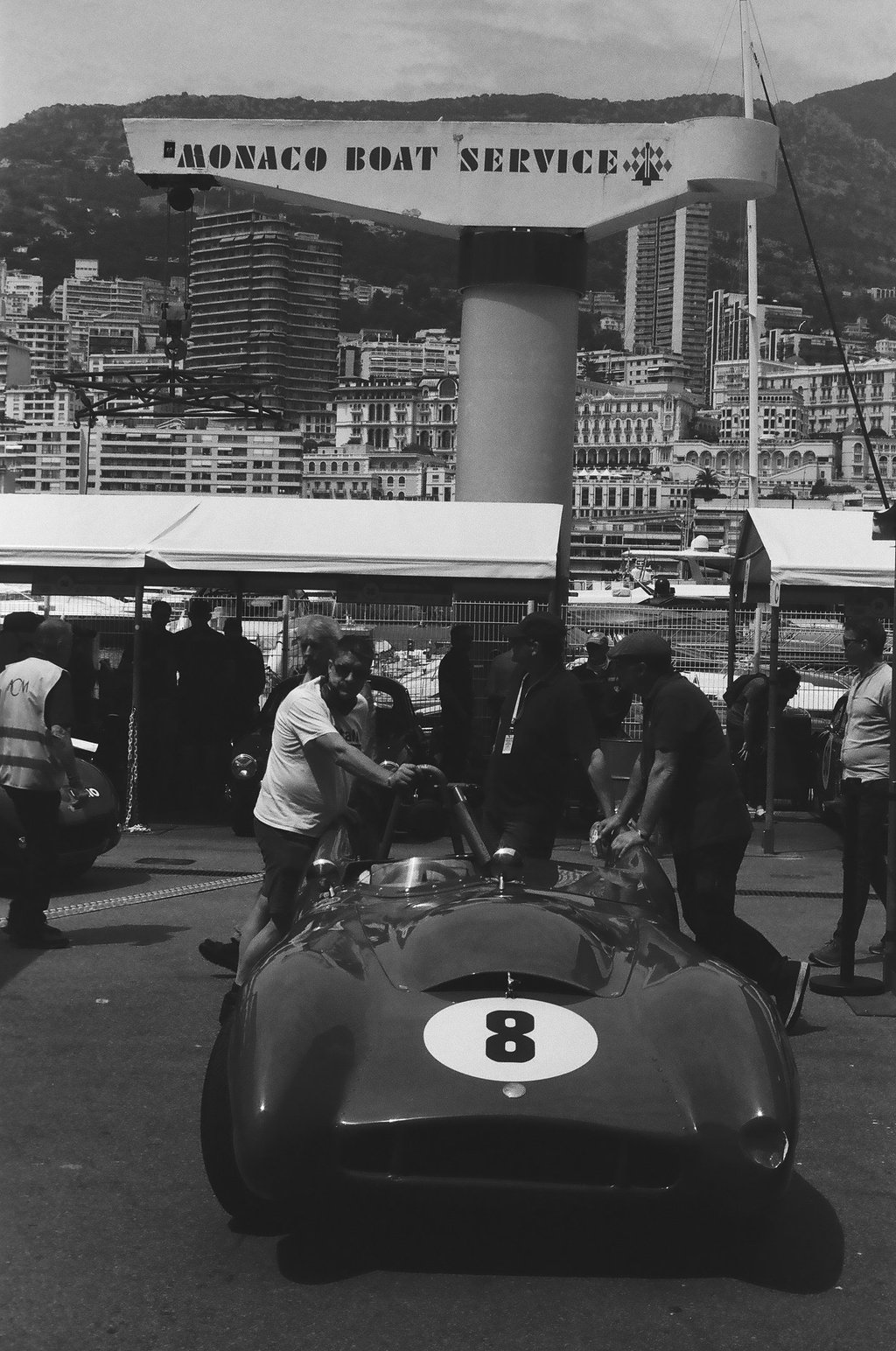 a race car parked in the paddock
