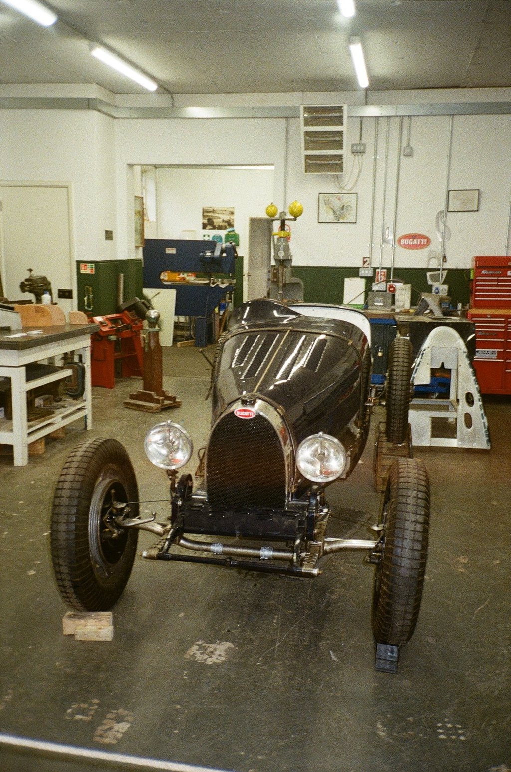 a vintage car parked in a garage