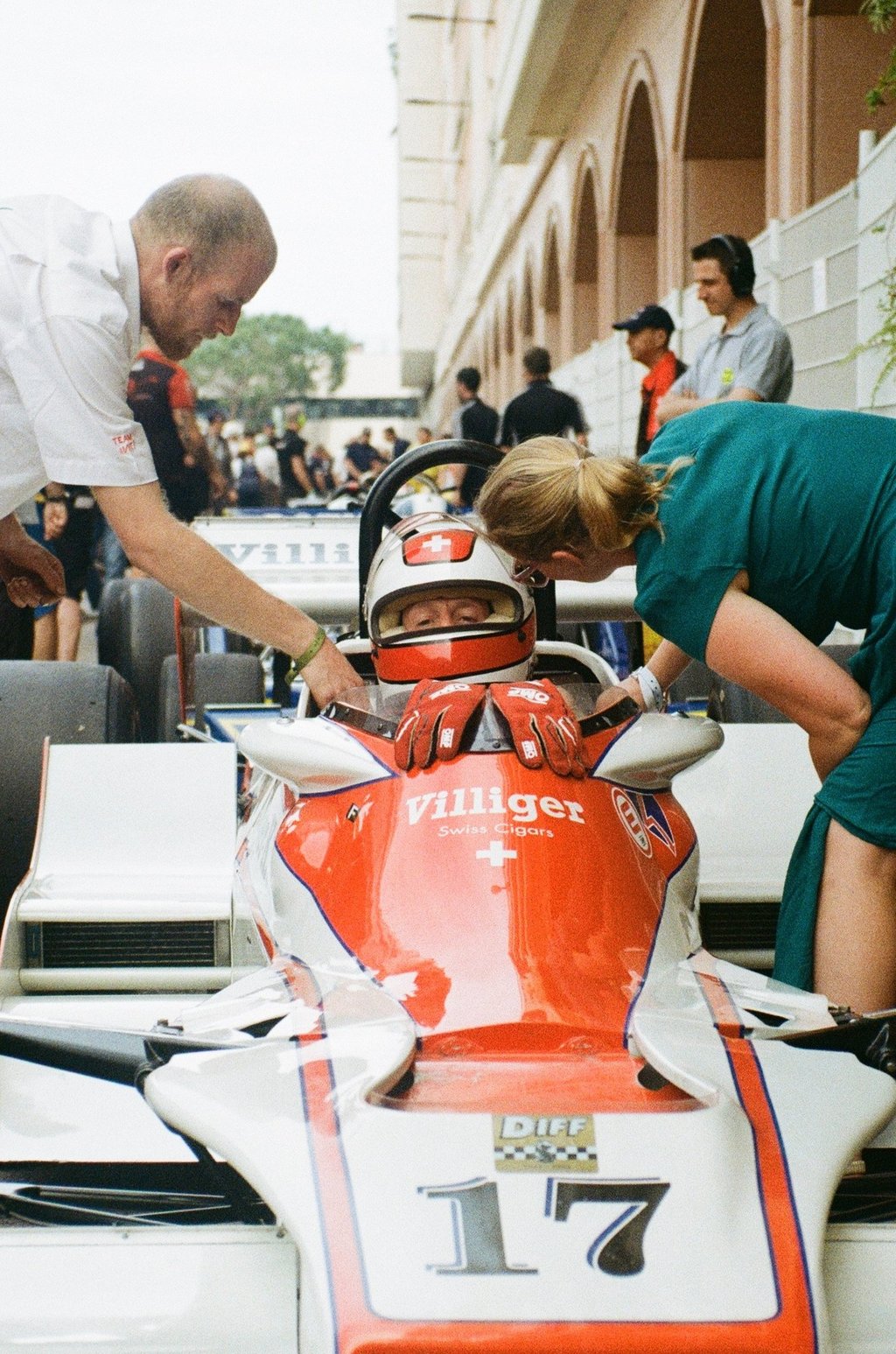 a race car driver getting ready before the race