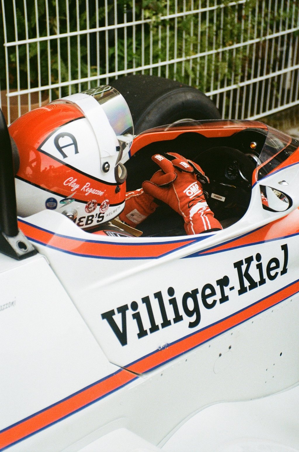 a race car driver getting ready before the race