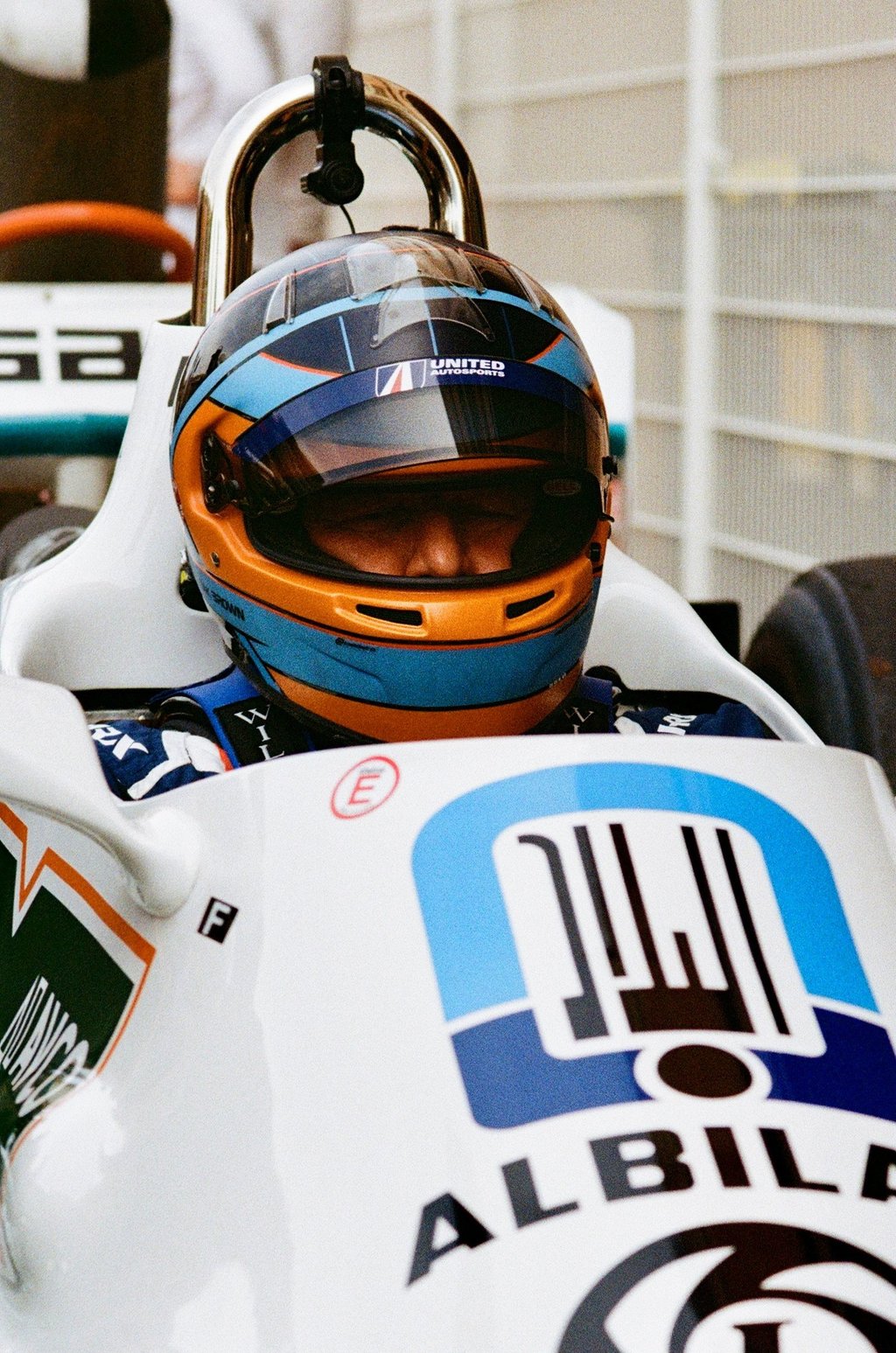 Zak Brown sat in a racing car with his helmet on before a race