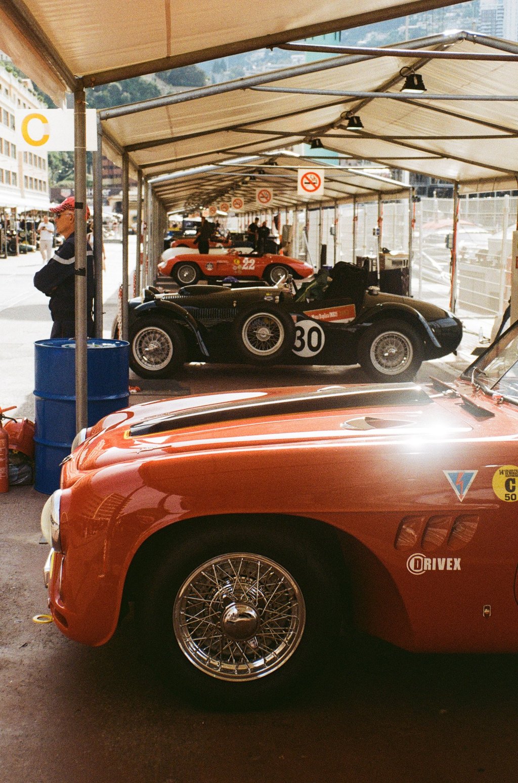 a race car parked in the paddock