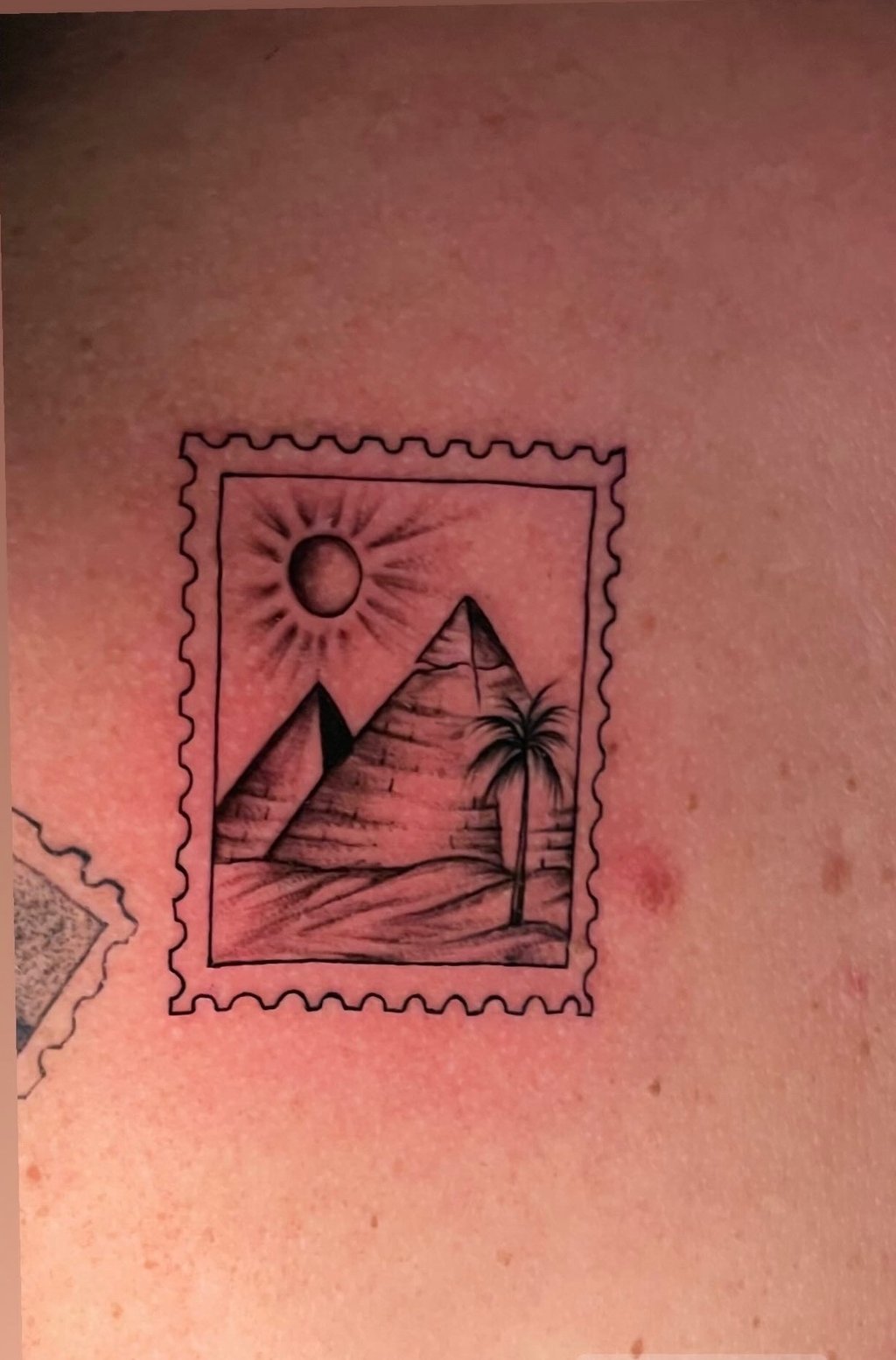 Pyramid tattoo on arm fin line—hurghada tattoo studio 