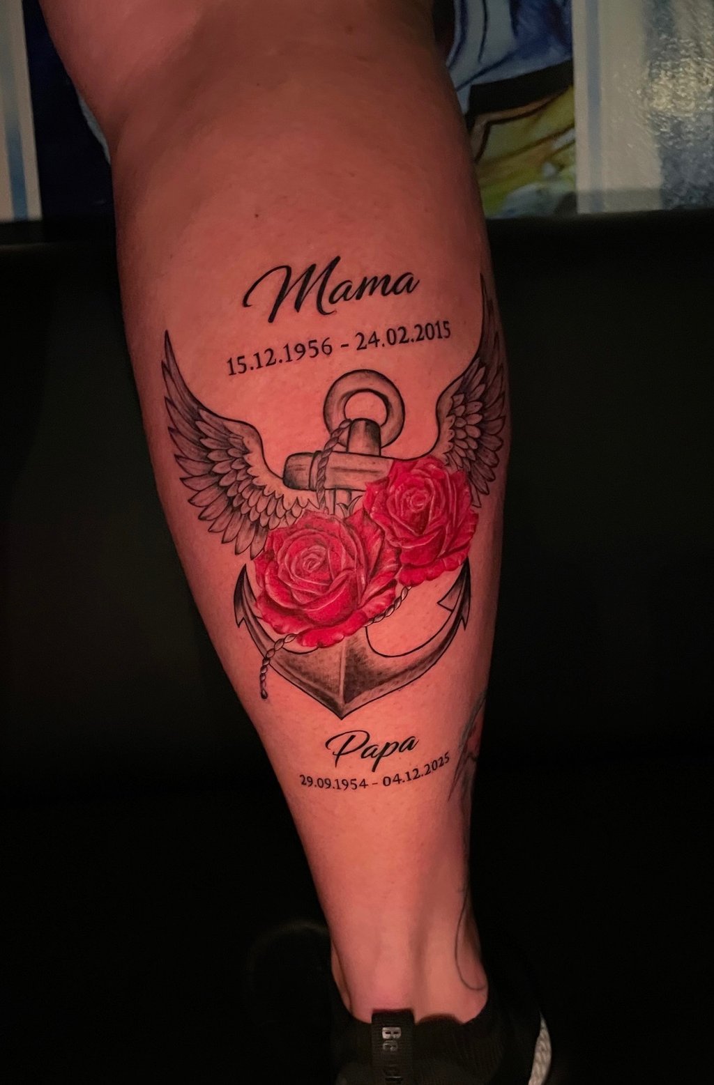 Memorial tattoo on lower leg with winged anchor and red roses, Hurghada tattoo studio”