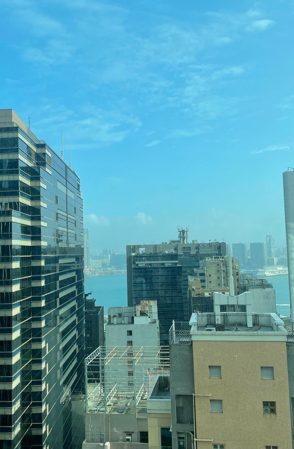 a city view of a city with a blue sky