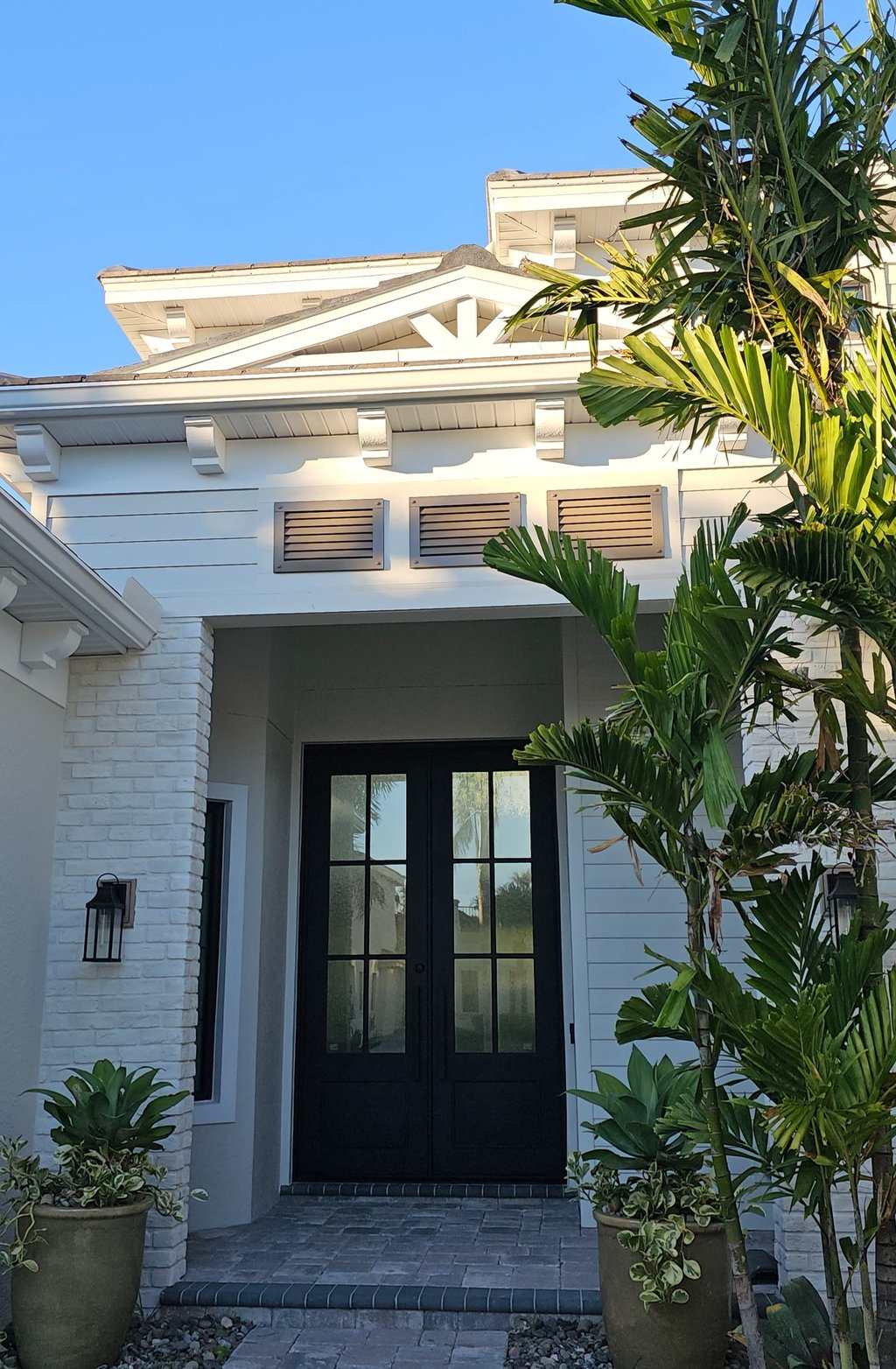 Louver panels above the luxury home entrance 