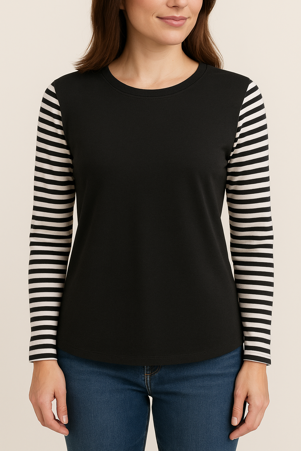 A woman wearing a black t-shirt with black and white striped sleeves.