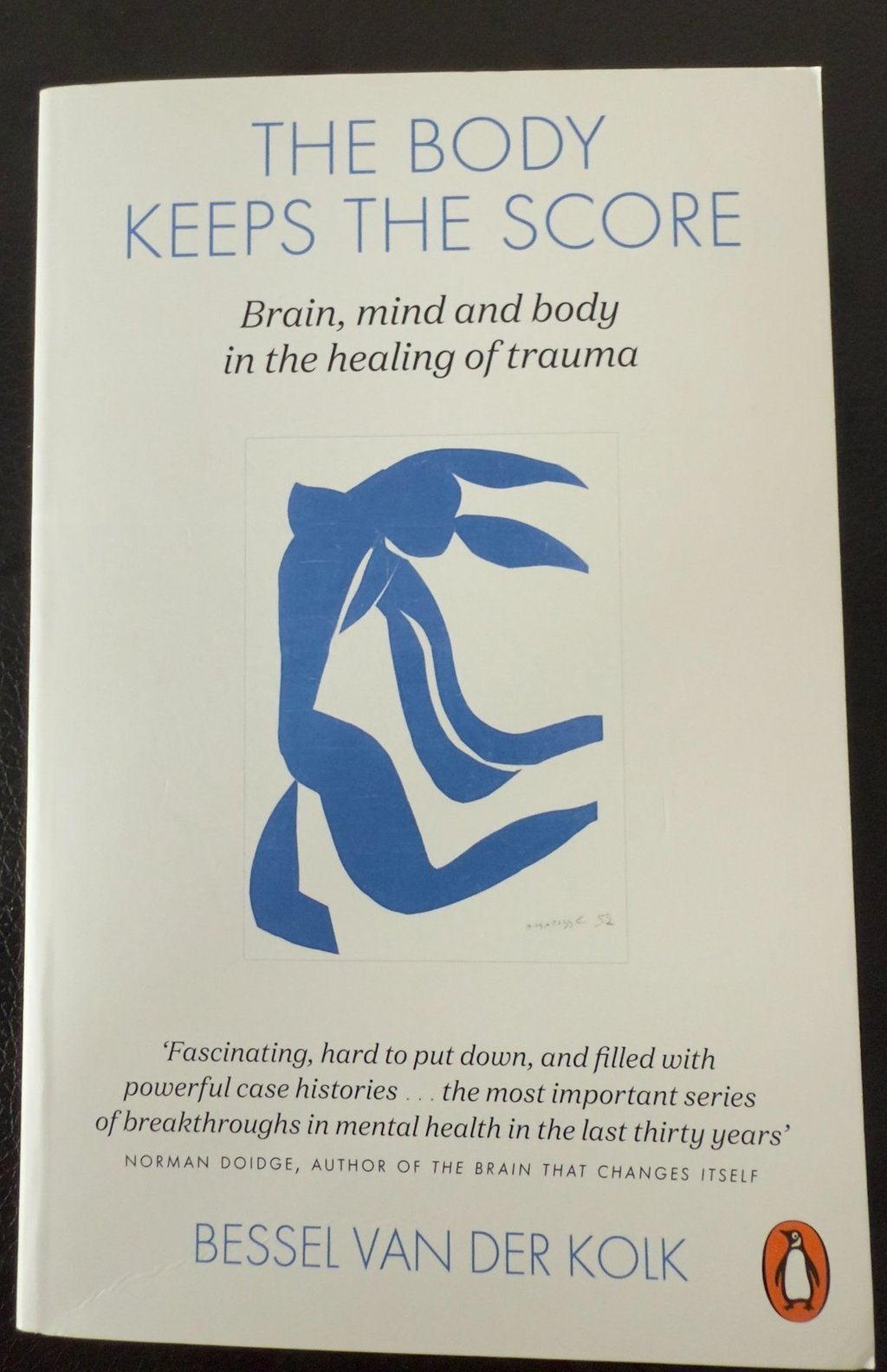 a book cover of the book the body keeps the score