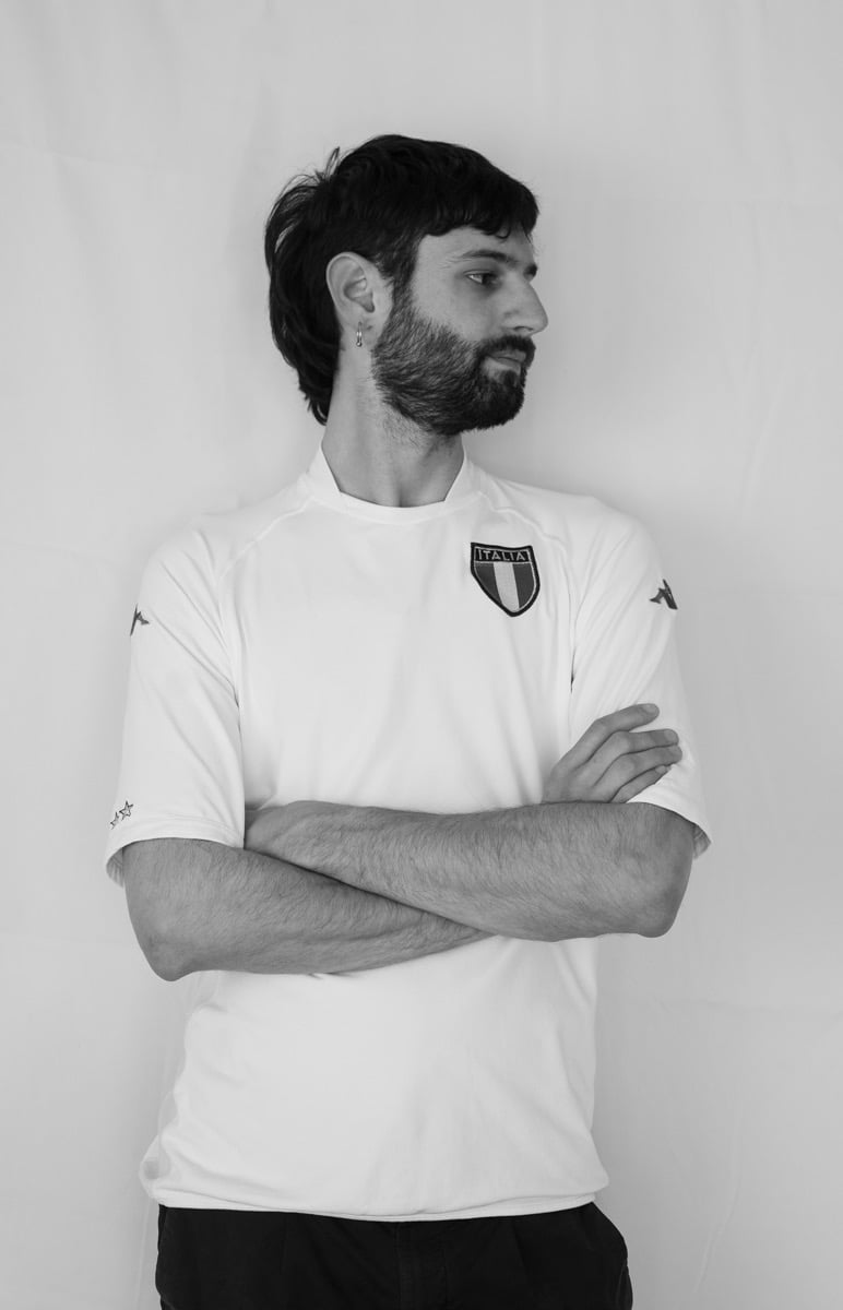 man standing looking to the left with crossed arms