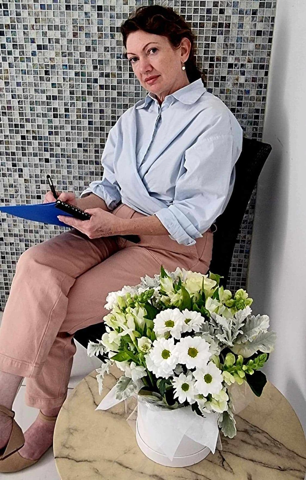 Marisa - therapist sitting in a chair