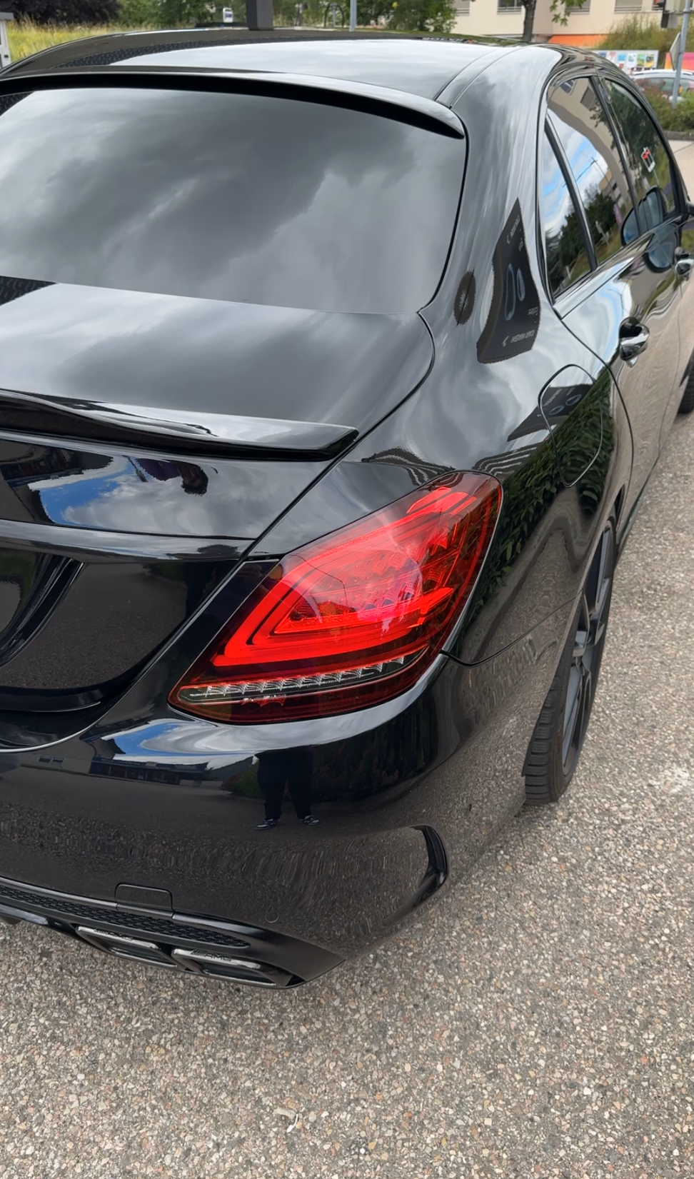 a black car parked in a parking lot