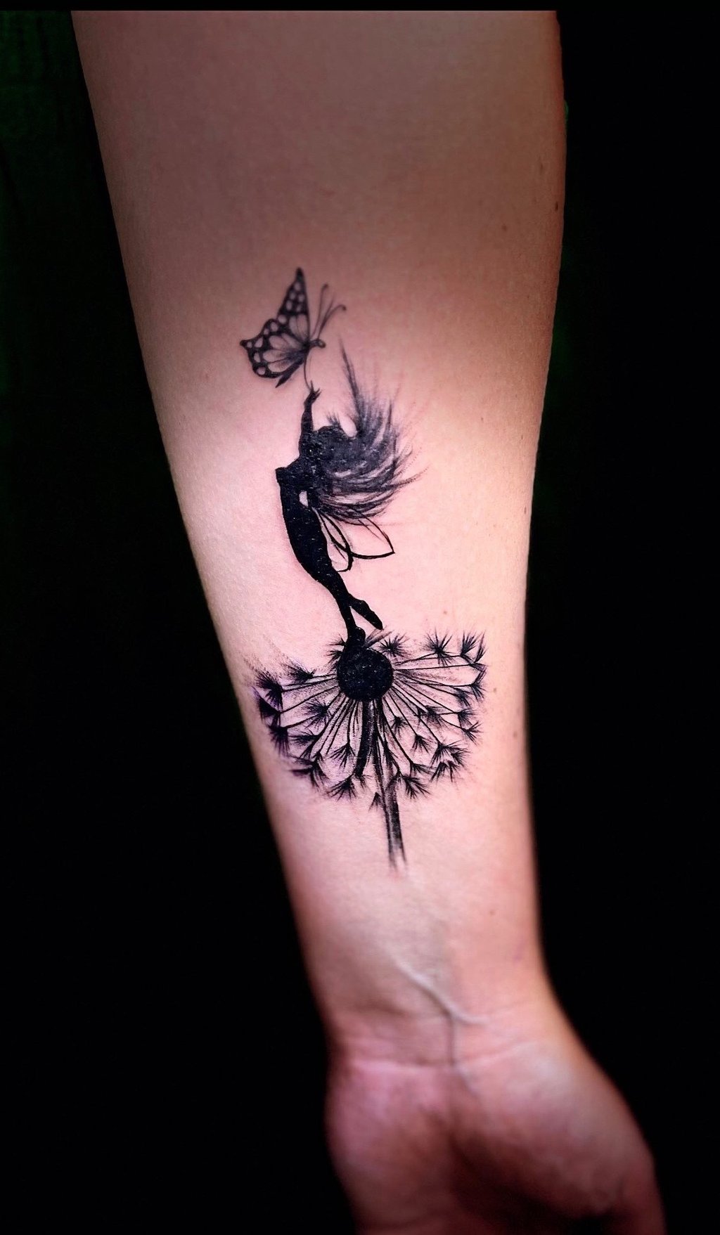 Feather tattoo in fine line on forearm — Hurghada Tattoo Studio