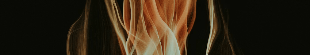 An abstract banner featuring fluid, flowing ribbons of fire in vibrant orange, red, and gold against a dark background.