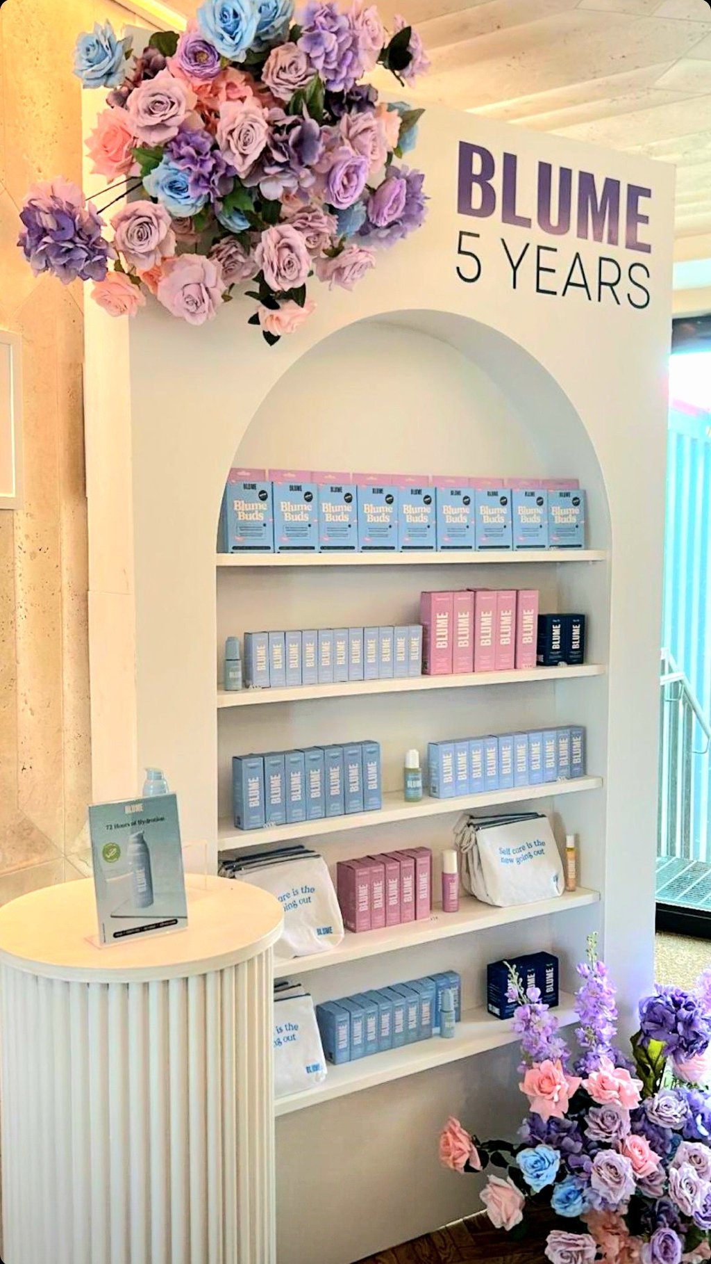 Champagne/ Treat wall of cosmetics products by Blume and flowers at Milky at the Stackt Market