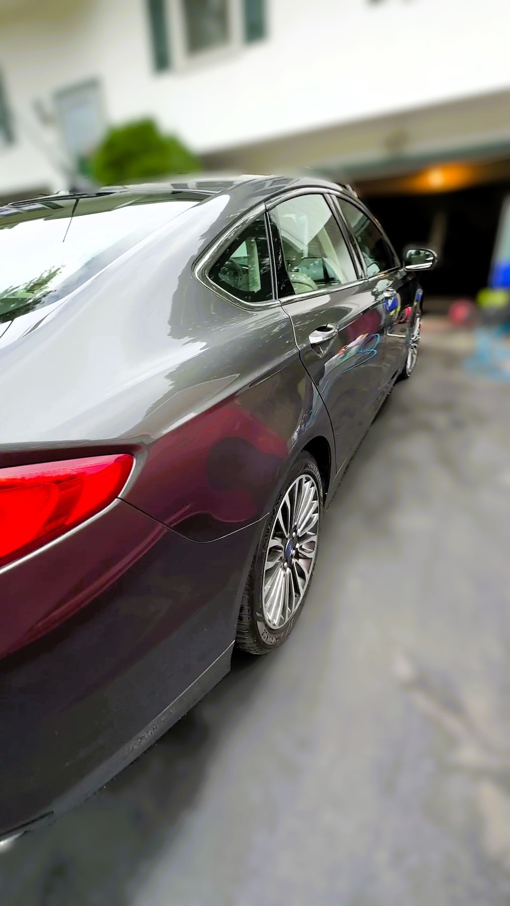 ceramic coating on a grey sedan