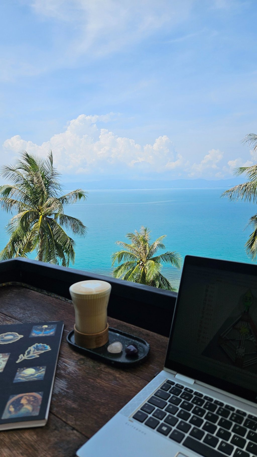 remote work laptop looking to the ocean tropical