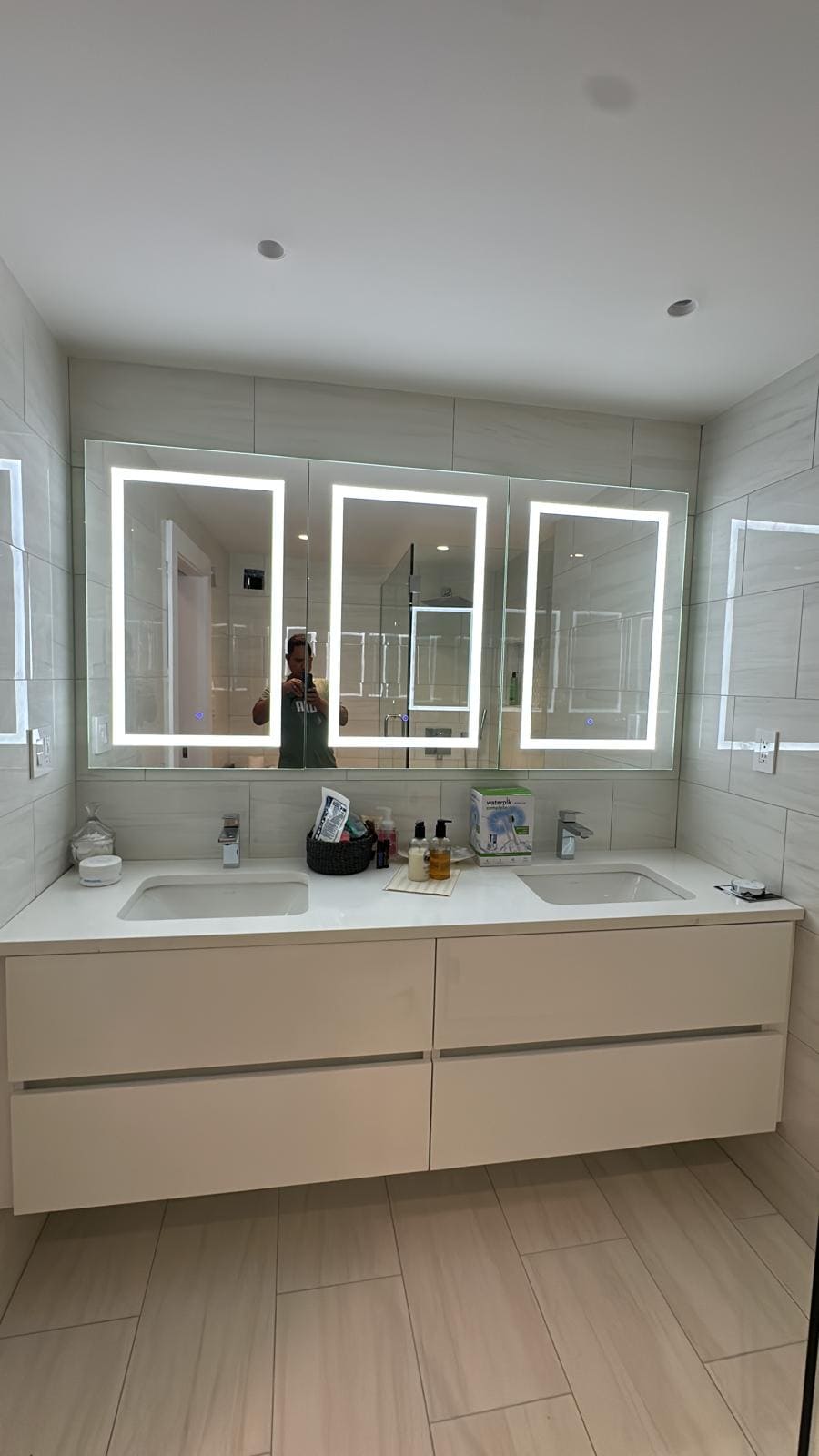 a bathroom with a mirror and a mirror