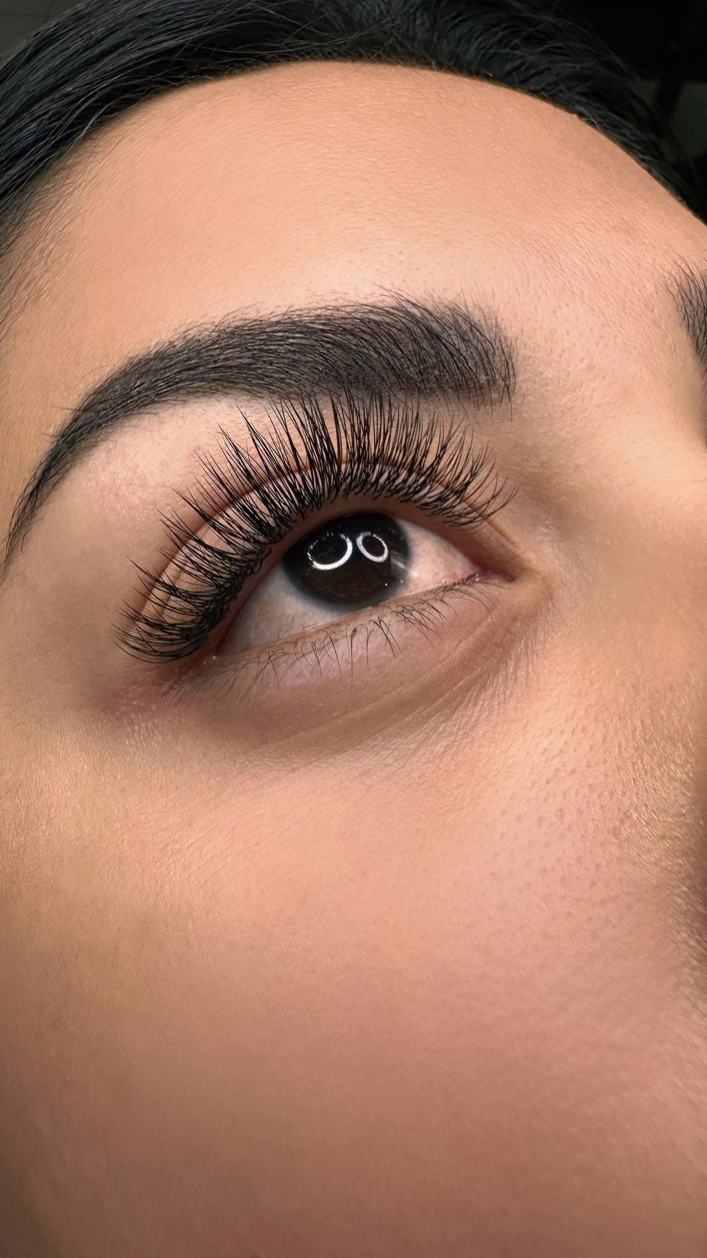 a woman with a black eyeliner and a black eyeliner