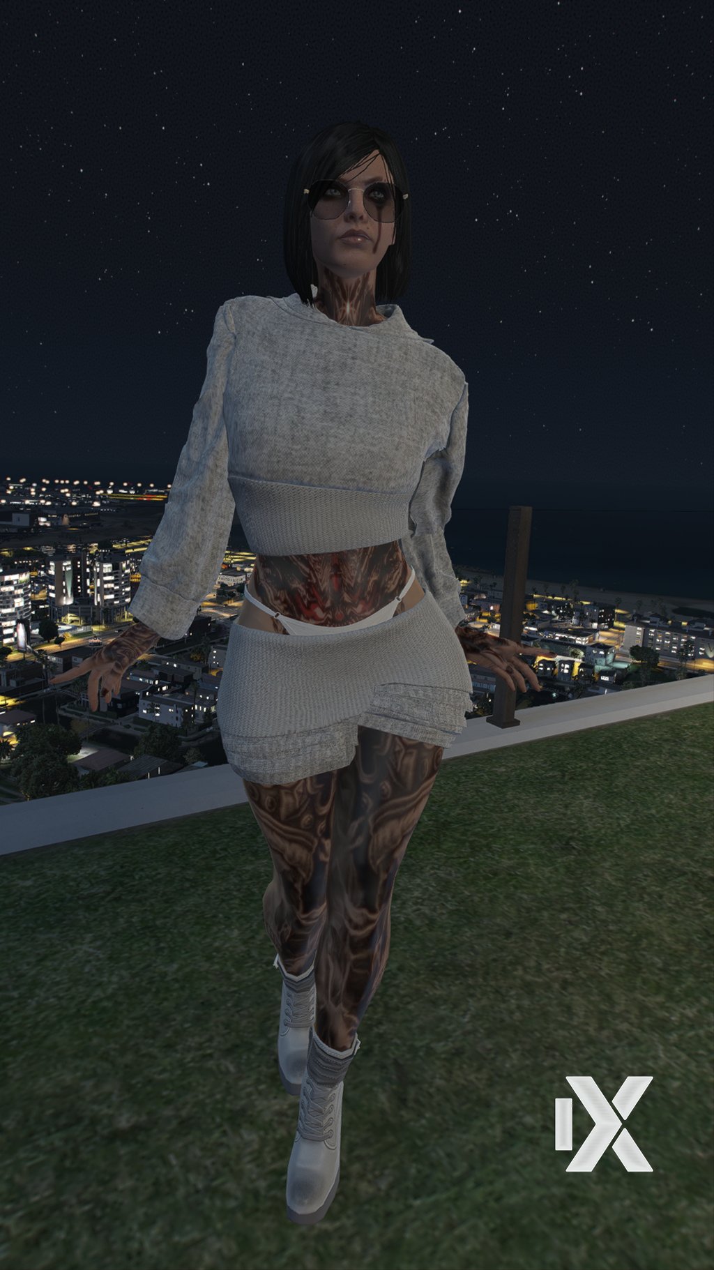 a woman in a white dress and sunglasses