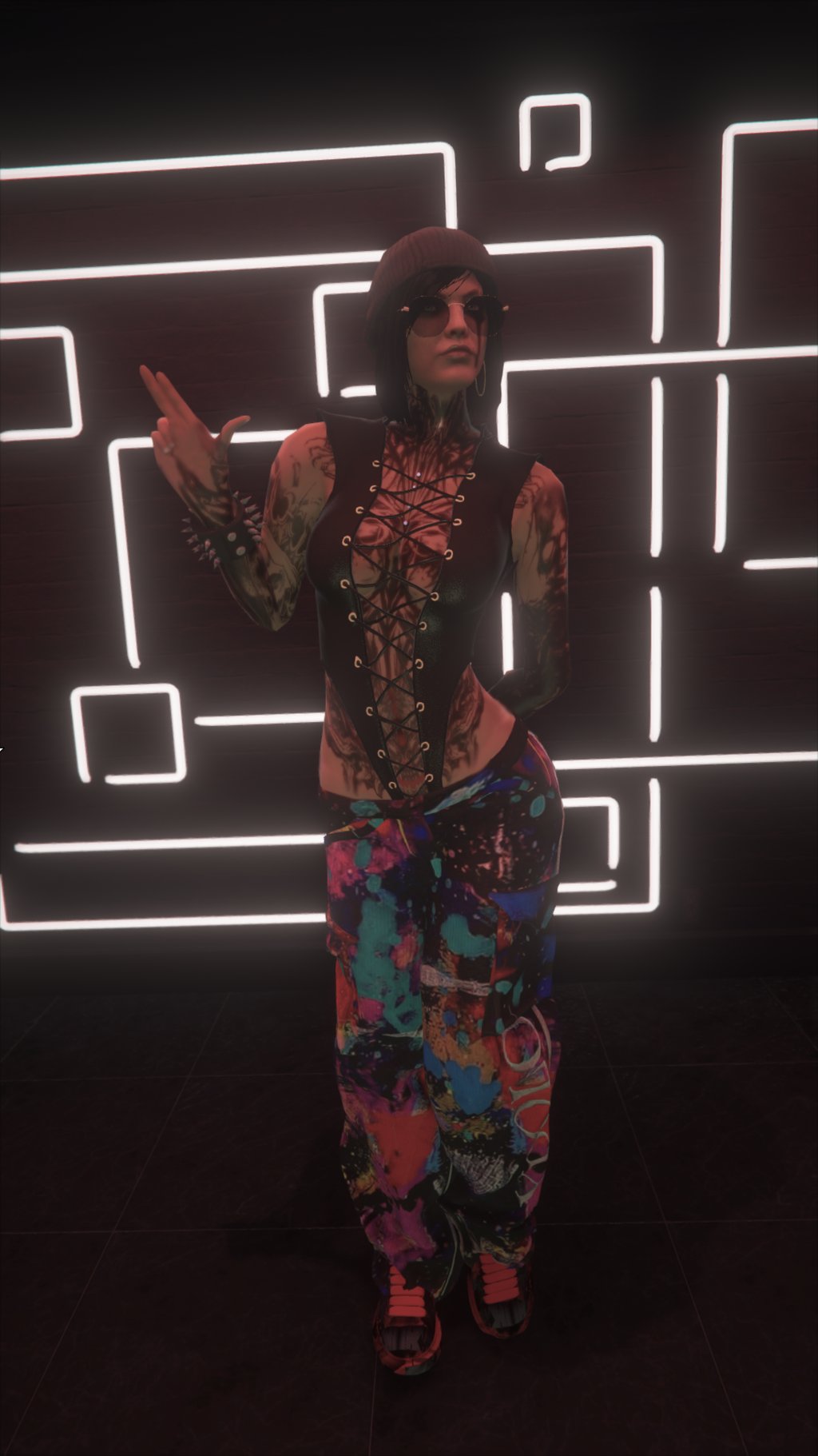 a woman in a colorful outfit standing in front of a neon - lit neon sign