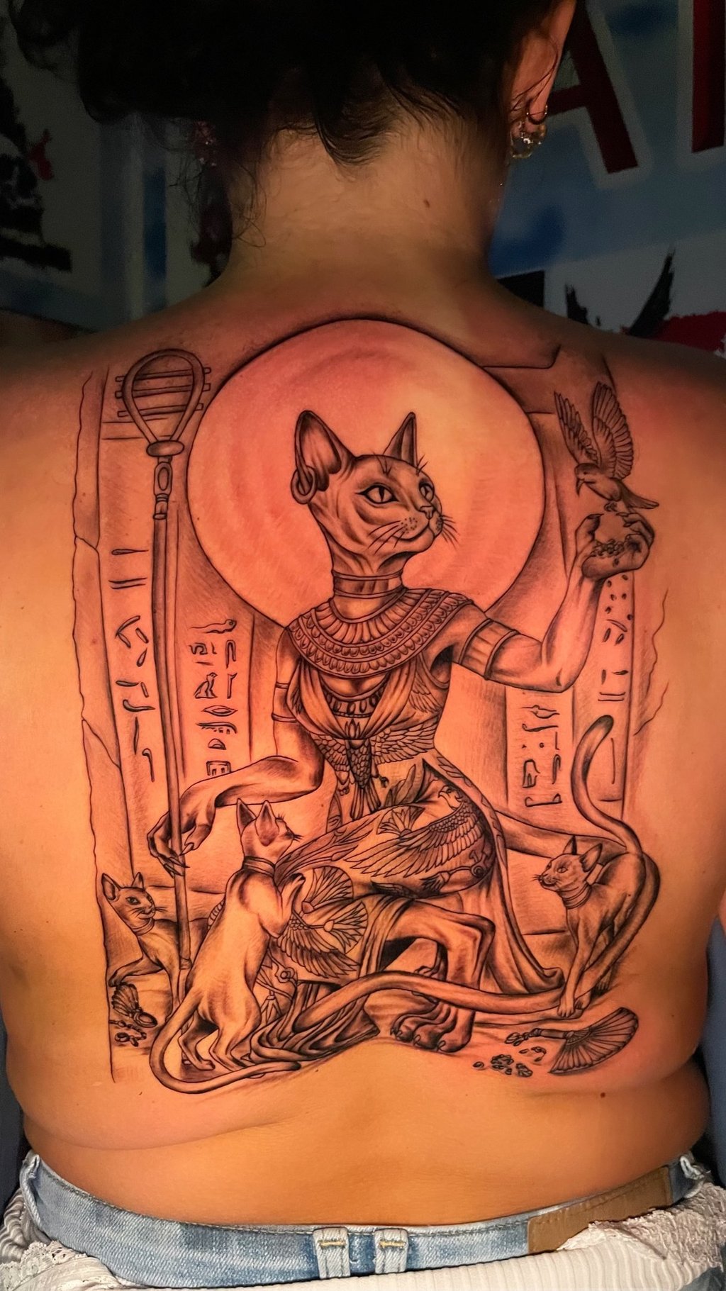 Large black and grey Egyptian Bastet cat goddess back tattoo  , Hurghada tattoo studio 