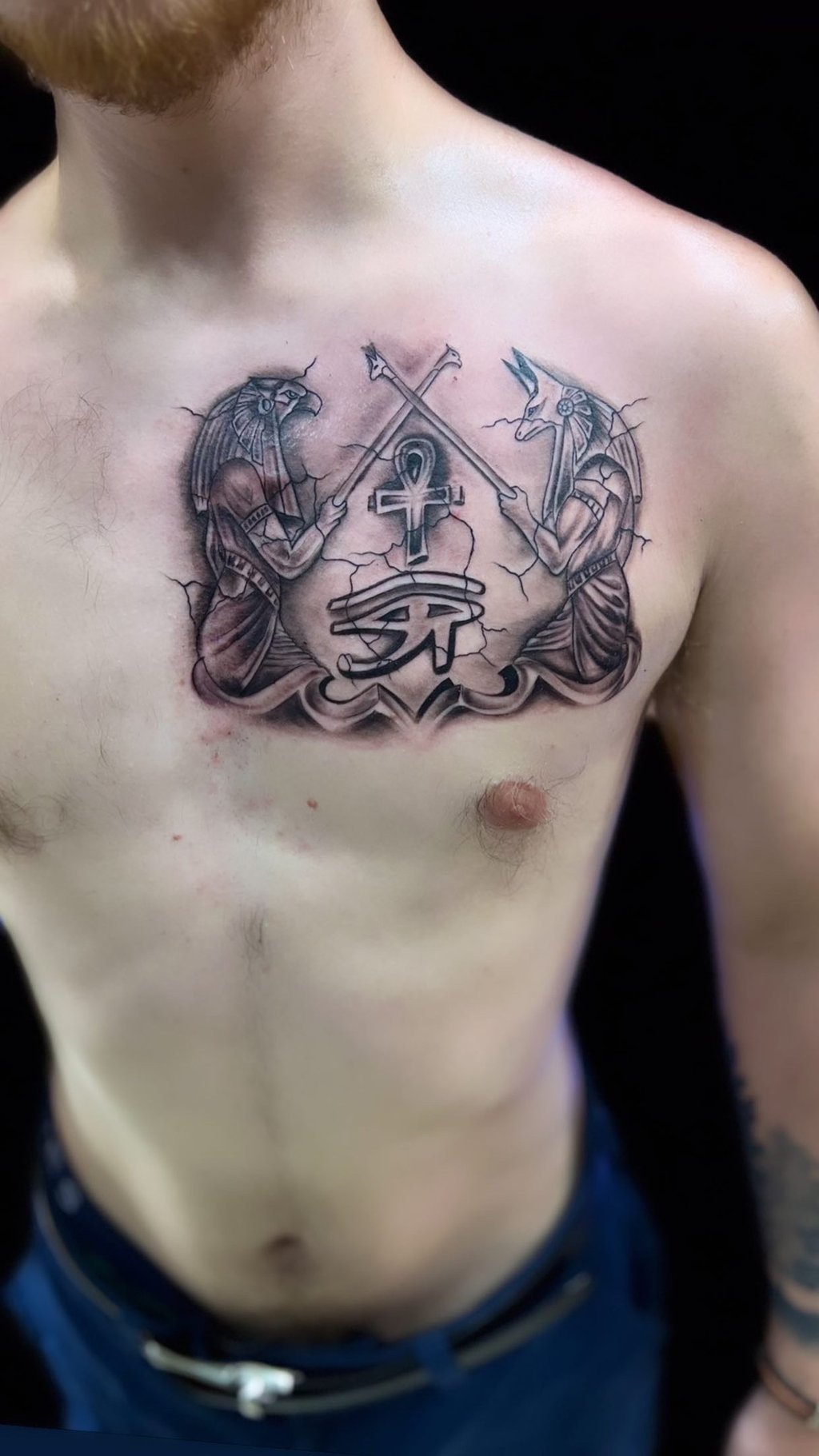 Anubis tattoo in black and grey on chest — Hurghada Tattoo Studio