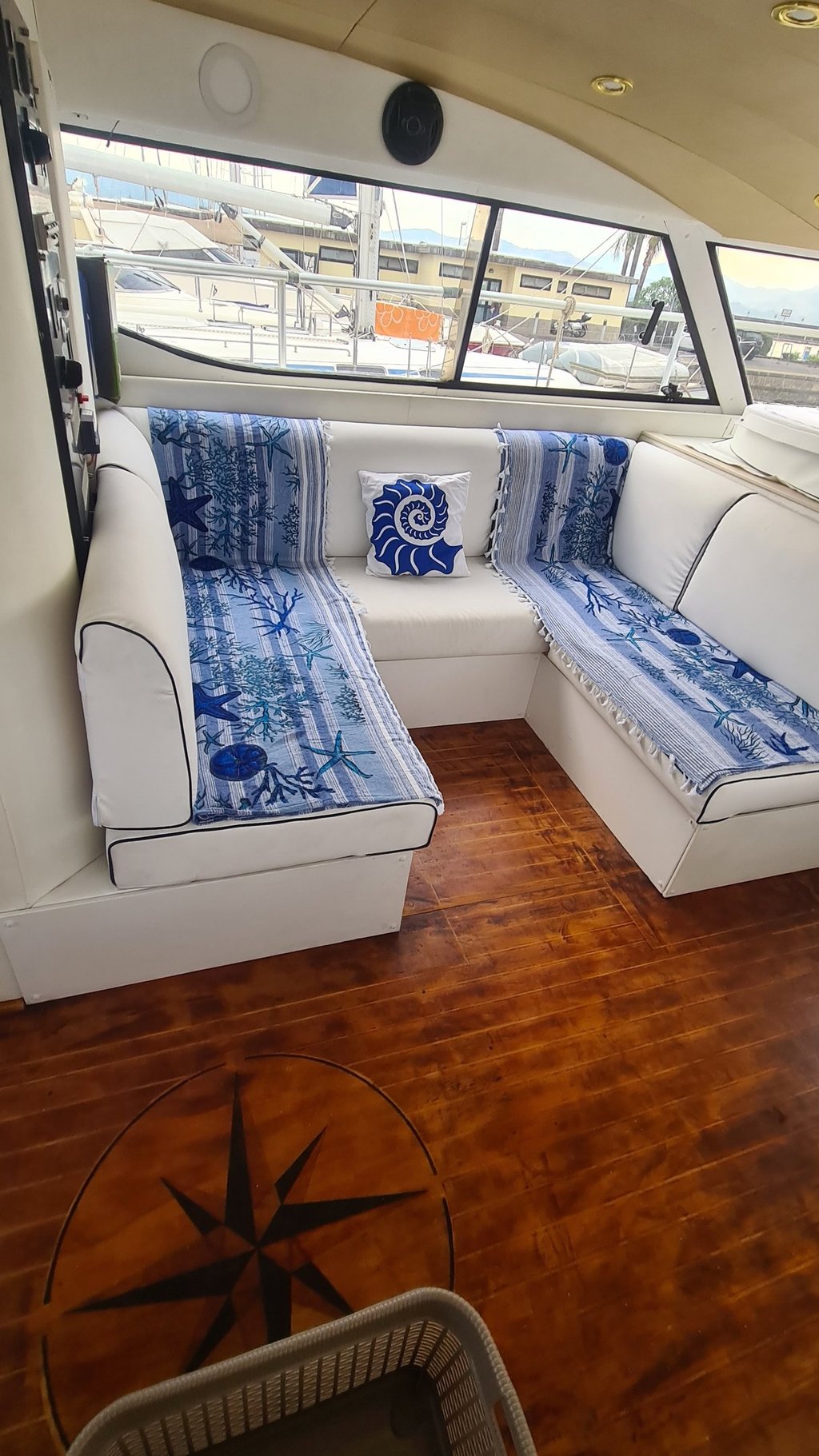 a couch with a blue and white couch and a compass compass