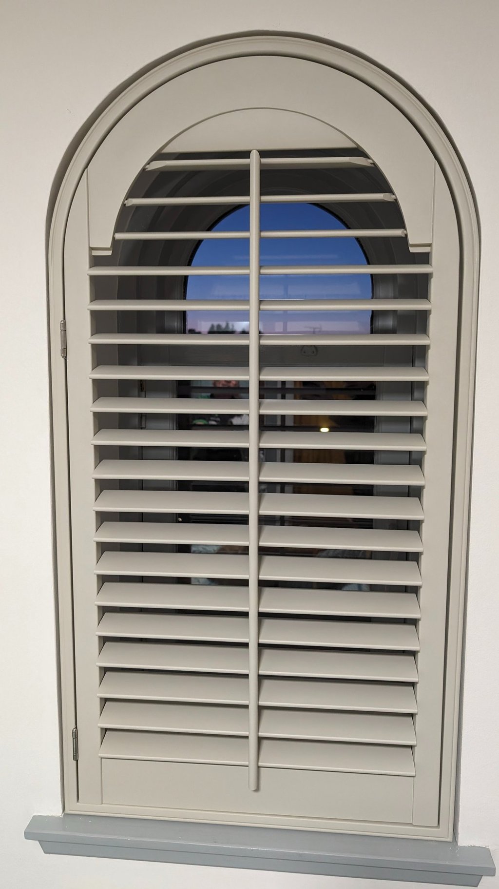 Shaped plantation shutter fitted to arched window in Aberdeen
