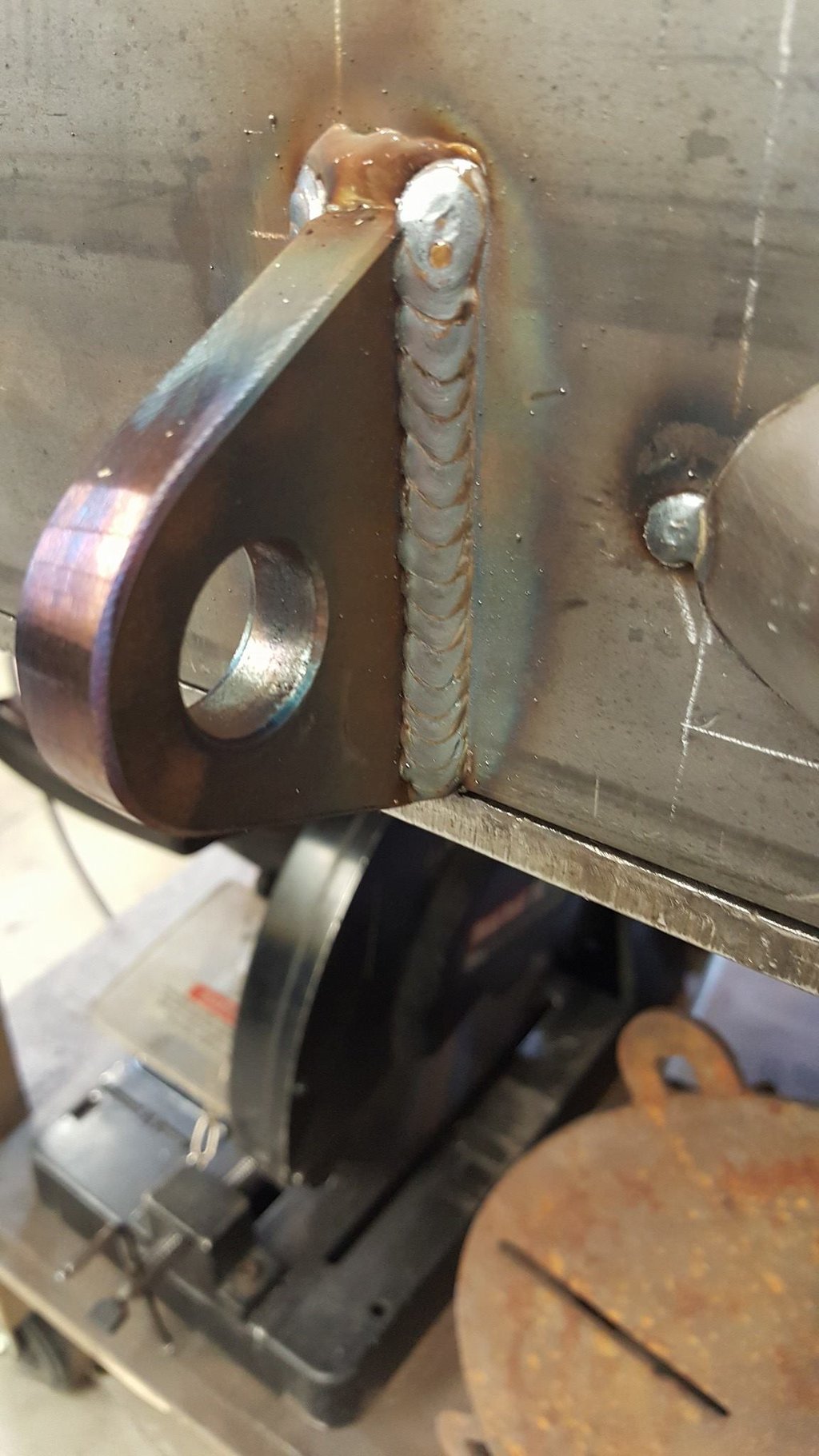 MIG welding a recovery tab on a custom bumper. Welding Okotoks, custom fabrication.